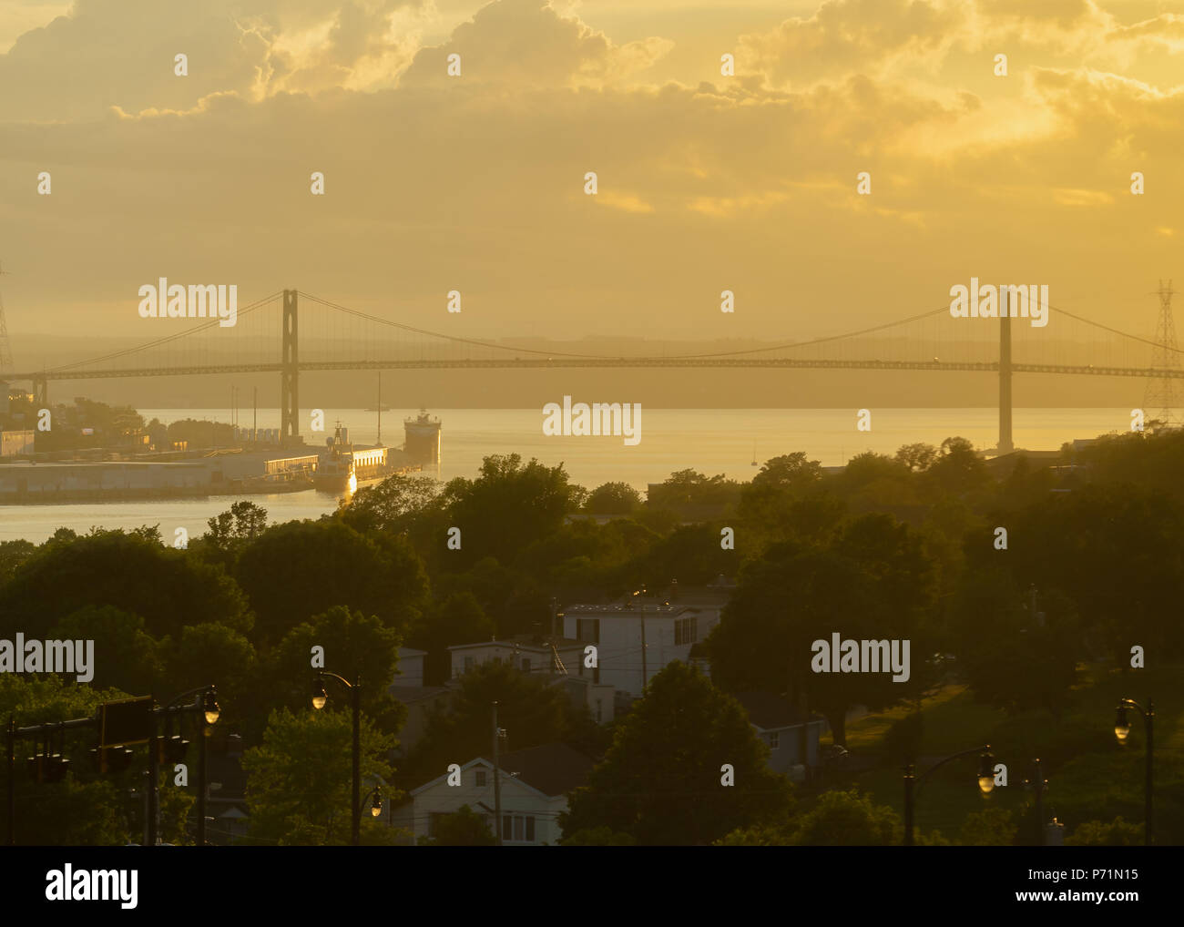 The A. Murray MacKay Bridge spanning Halifax Harbour, Nova Scotia, prior to sunset. Stock Photo