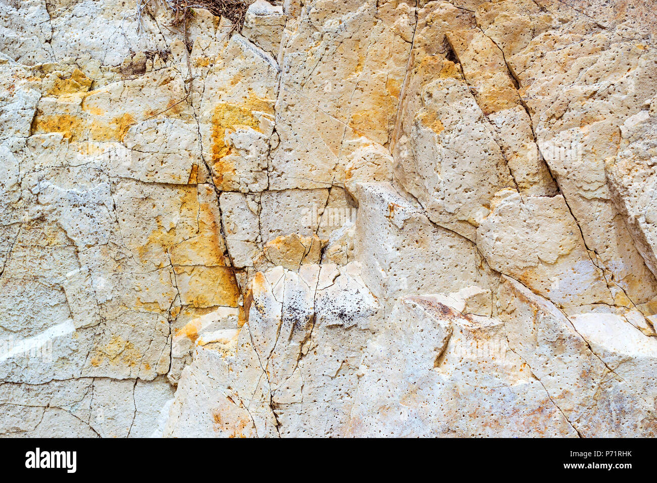 White stone texture. Rock formation with cracks and protrusions. Mountain of castle San Juan. Spanish beach resort Blanes in summertime, Costa Brava,  Stock Photo