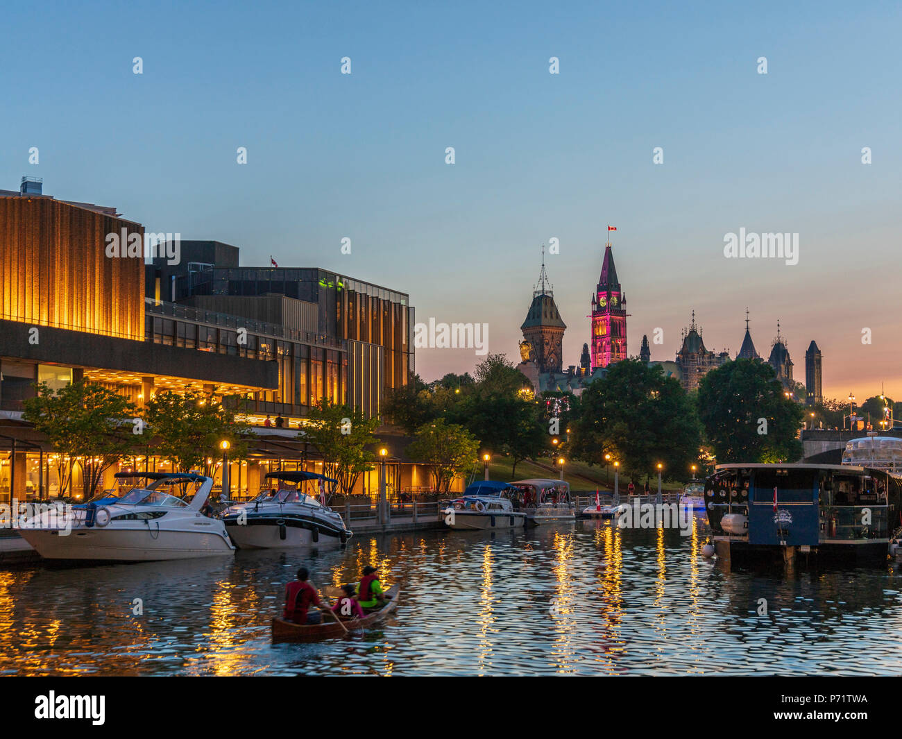 Family paddles canoe in Ottawa Rideau Canal to watch Canada Day