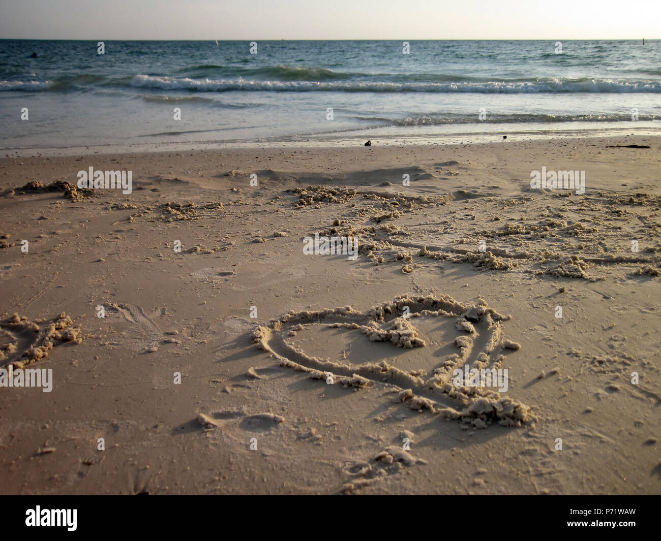 an image of heart shape drawing on the sand Stock Photo - Alamy