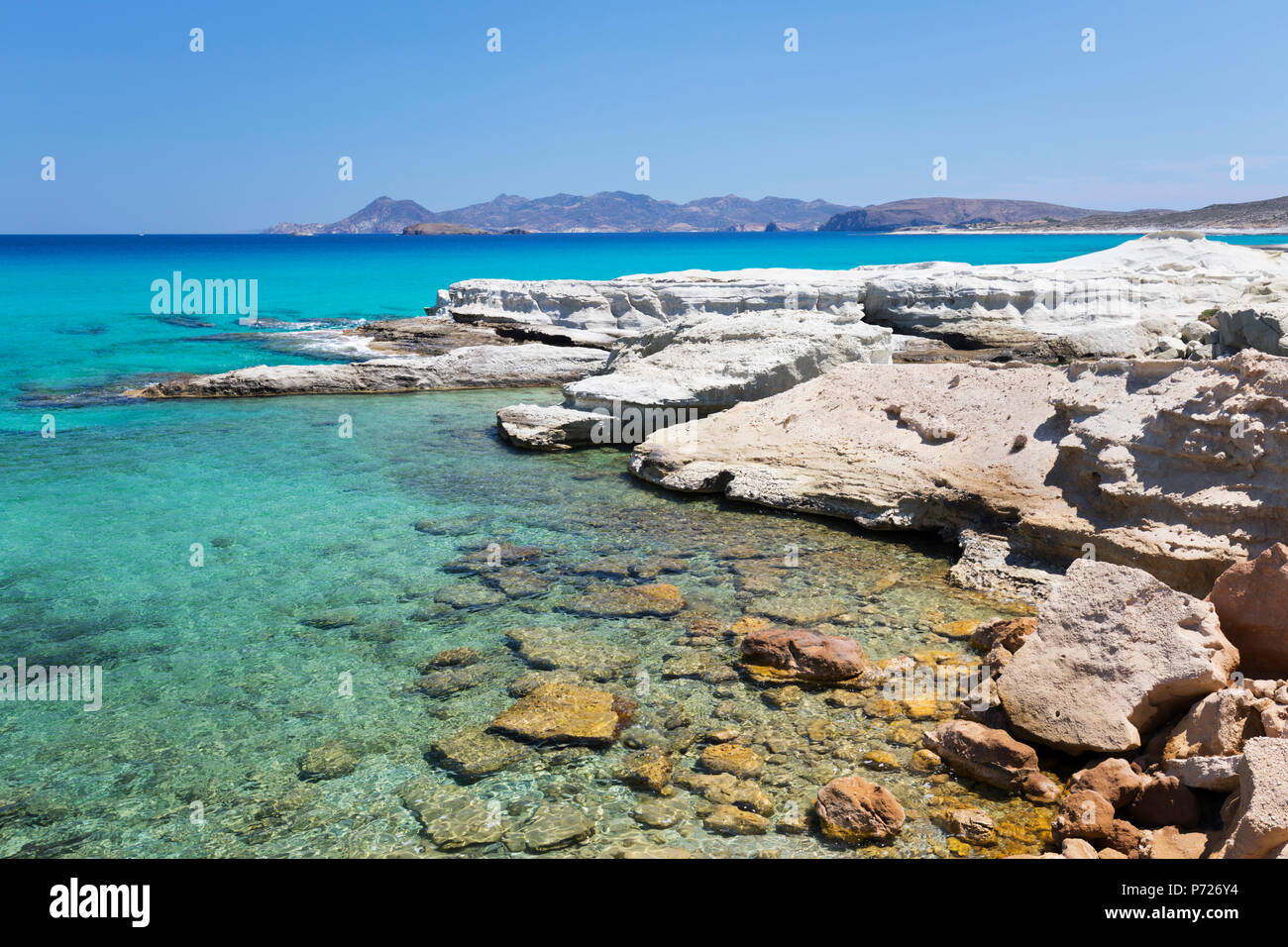Clear turquoise sea and volcanic rock formations at Sarakiniko, Sarakiniko, Milos, Cyclades, Aegean Sea, Greek Islands, Greece, Europe Stock Photo