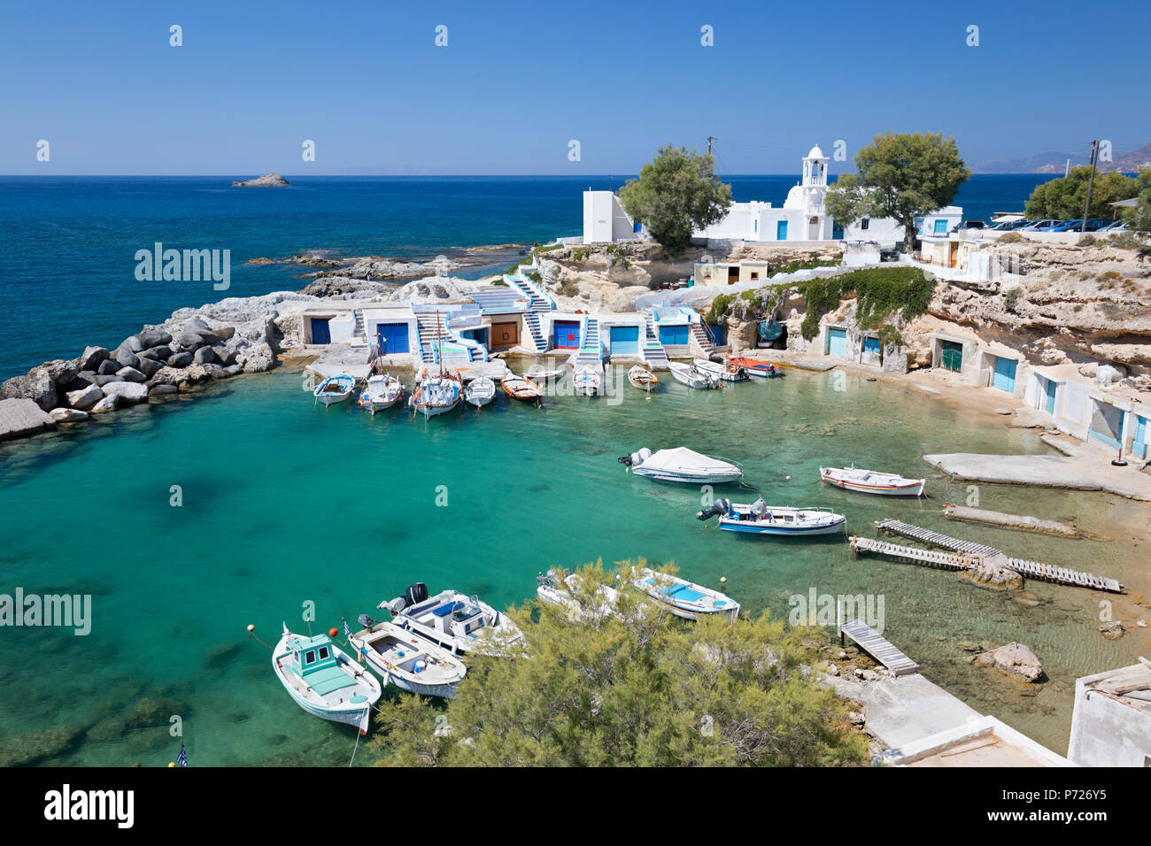 View over fishing harbour with boats and colourful boat houses, Mandrakia, Milos, Cyclades, Aegean Sea, Greek Islands, Greece, Europe Stock Photo