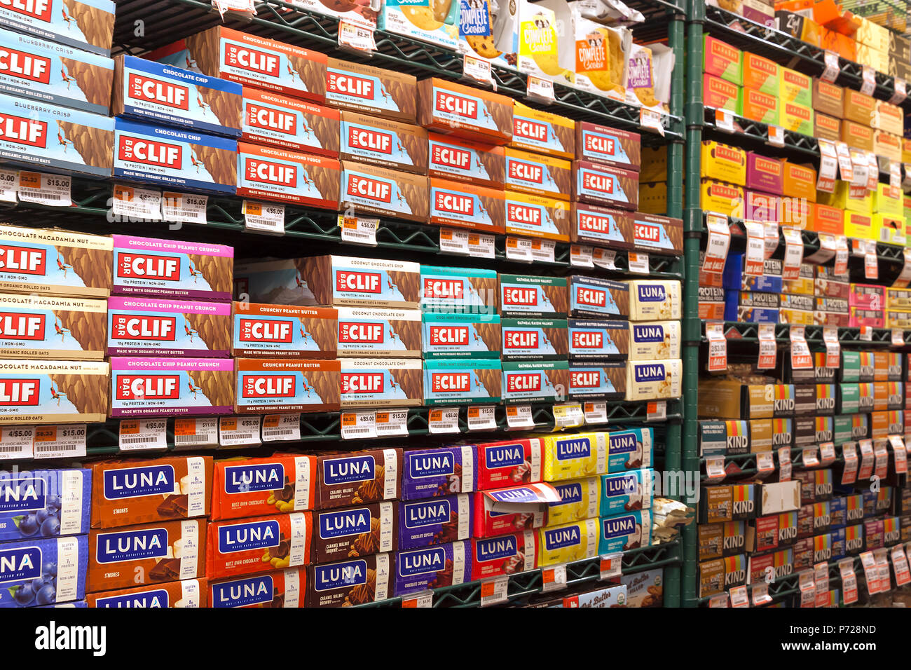 Popular energy bars for sale on supermarket store shelves. Stock Photo
