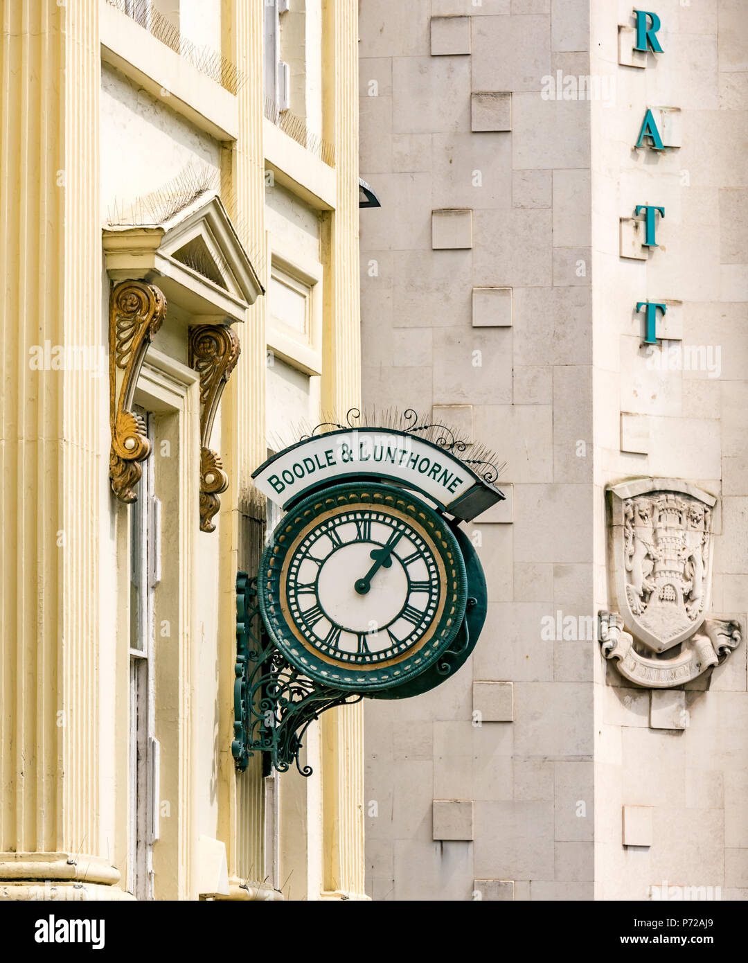 Decorative wall mounted clock on Boodles luxury jewellery store, Lord Street, Liverpool, England, UK Stock Photo