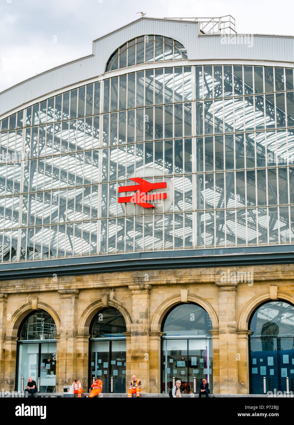 Curved glass roof of Liverpool Lime Street mainline railway station with Network Rail symbol, Liverpool, England, UK Stock Photo
