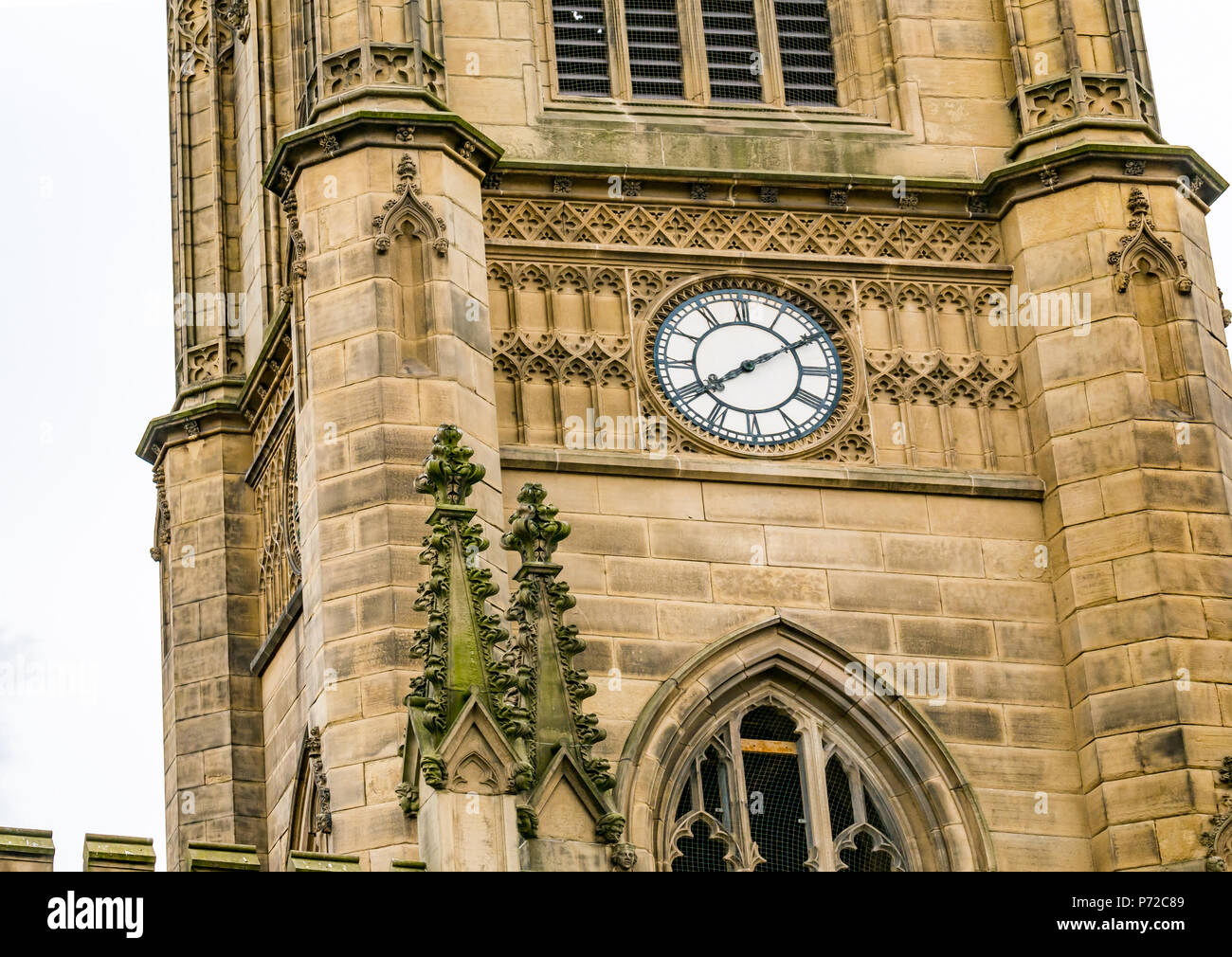Close up view of St Luke's Bombed Out Church clock tower, Liverpool, England, UK, damaged by a bomb in World War II, now a ruin Stock Photo
