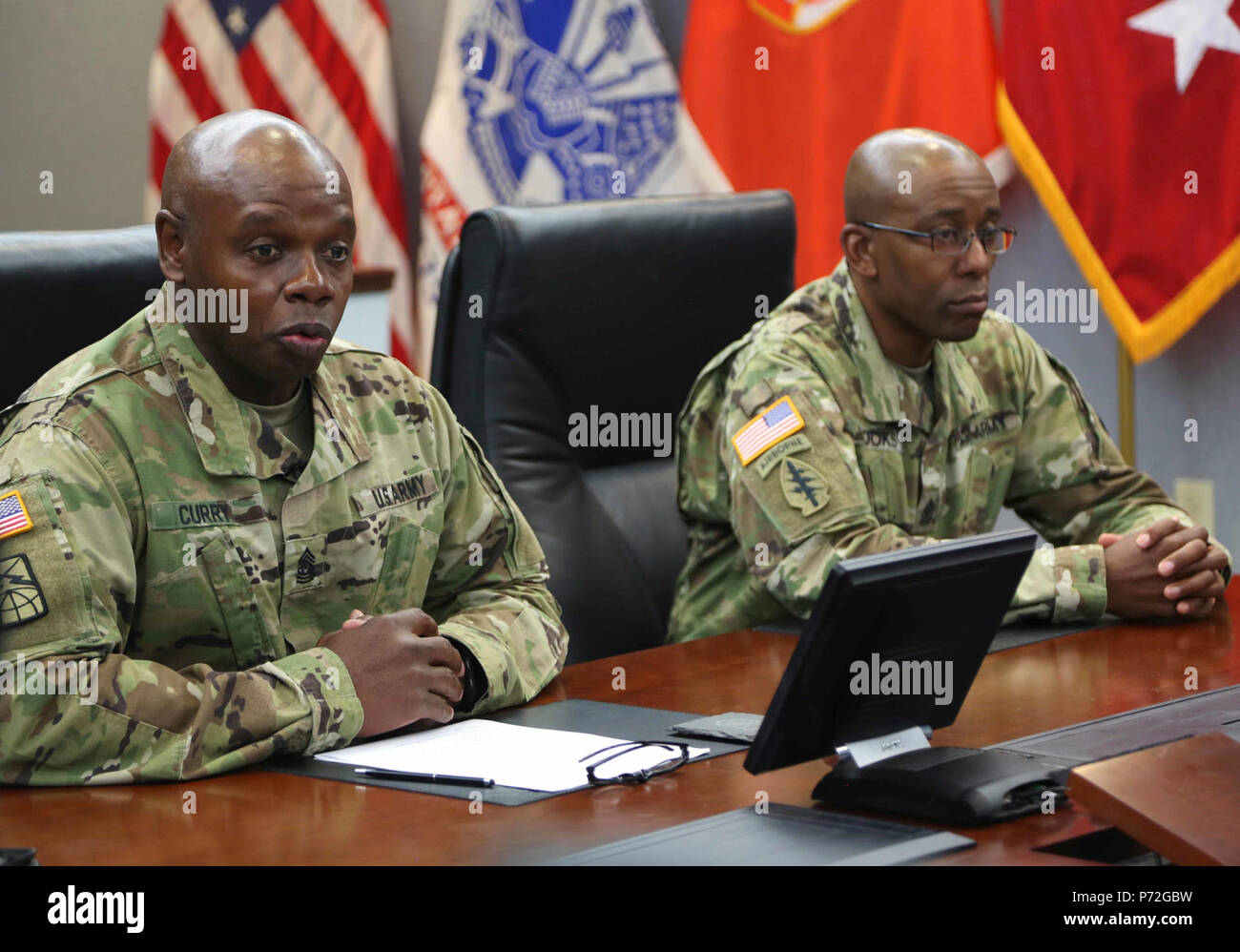 U.S. Army Master Sgt. Richard Torres, Command Sgt. Maj. Darris Curry, and Sgt. Maj. Terrance Brooks, both assigned to Headquarters and Headquarters Company (HHC) Network Enterprise Technology Command (NETCOM), attend a welcome brief for the 2017 NETCOM Best Warrior Competition at Fort Huachuca, Az., May 12, 2017. The welcome brief was organized to introduce the NETCOM Command Team to Soldiers competing for the 2017 NETCOM Noncommissioned Officer and Soldier of the year. Stock Photo