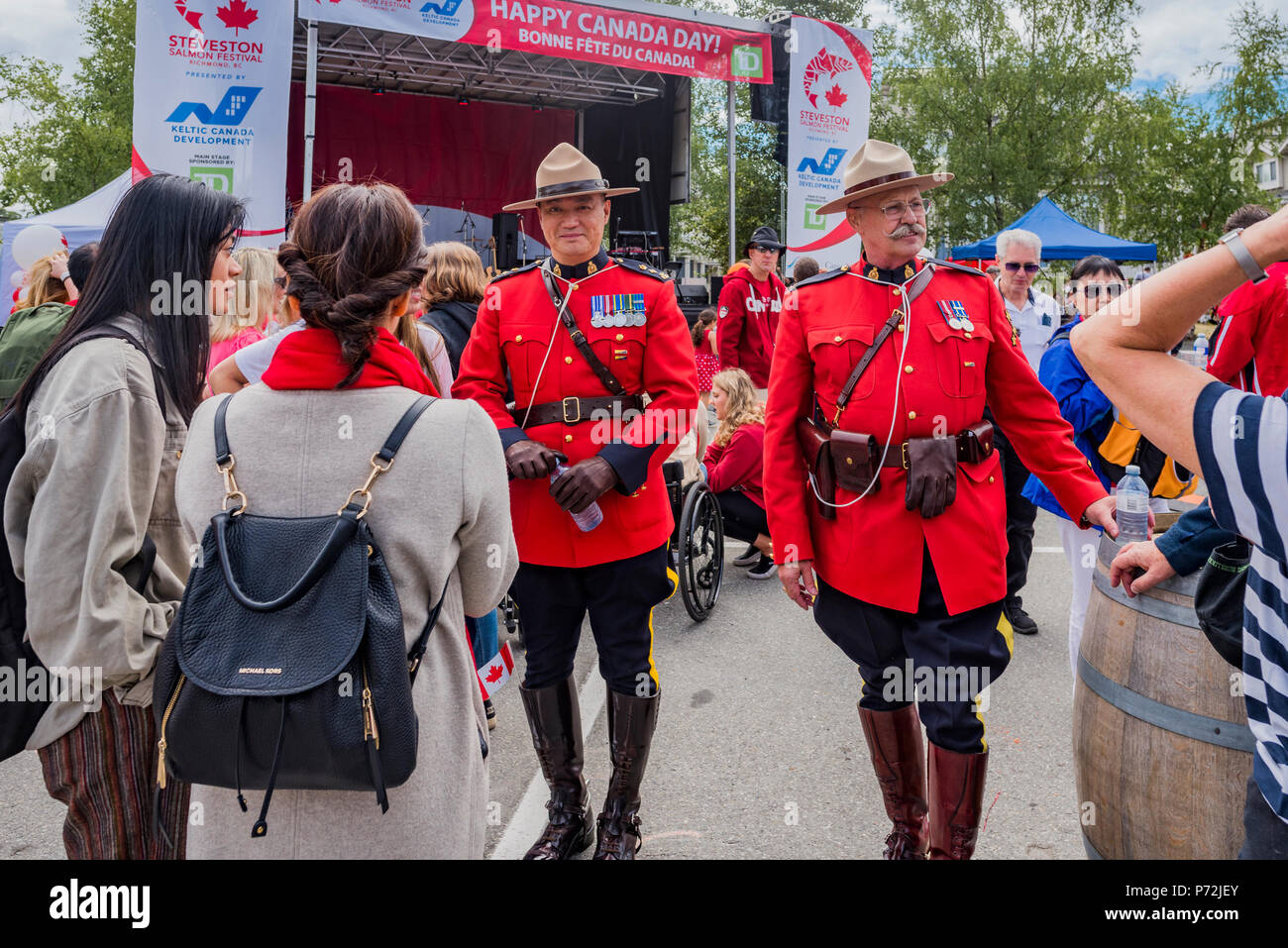 Mounties in red serge uniforms, Canada Day,  Steveston, Richmond, British Columbia, Canada. Stock Photo