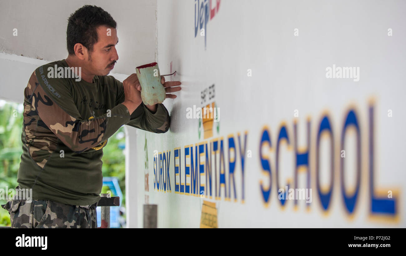 Philippine Navy Engineer Aide 3rd Class Francis Dairo Paints A