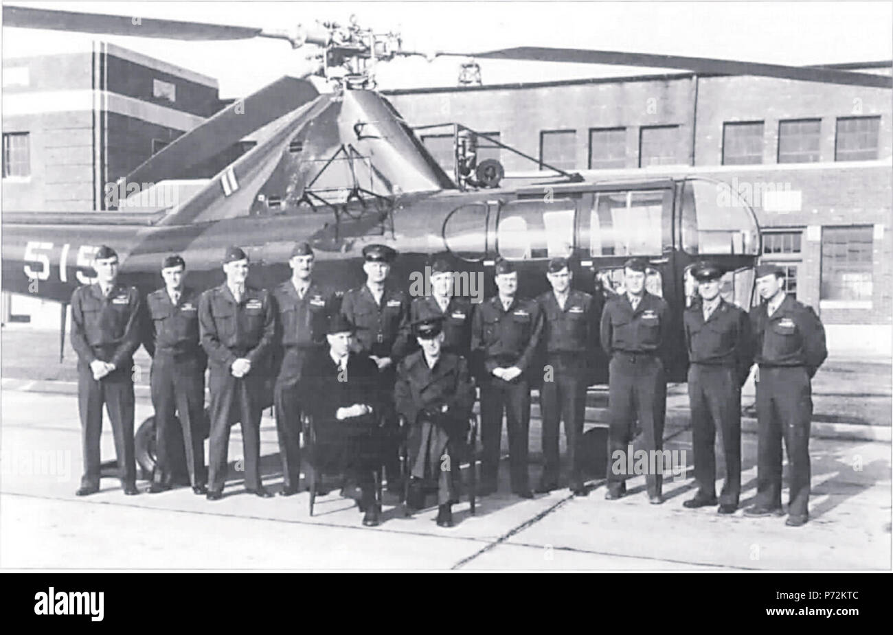 Inventor Igor Sikorsky, the father of American helicopters, visits HMX-1 at Marine Corps Air Station Quantico, Virginia.  In the background is an HO3S-1 helicopter, one of the first two “Whirlybirds” assigned to the U. S. Marine Corps. Stock Photo