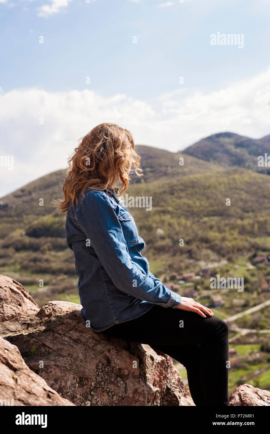 Girl sitting on edge cliff hires stock photography and images Alamy