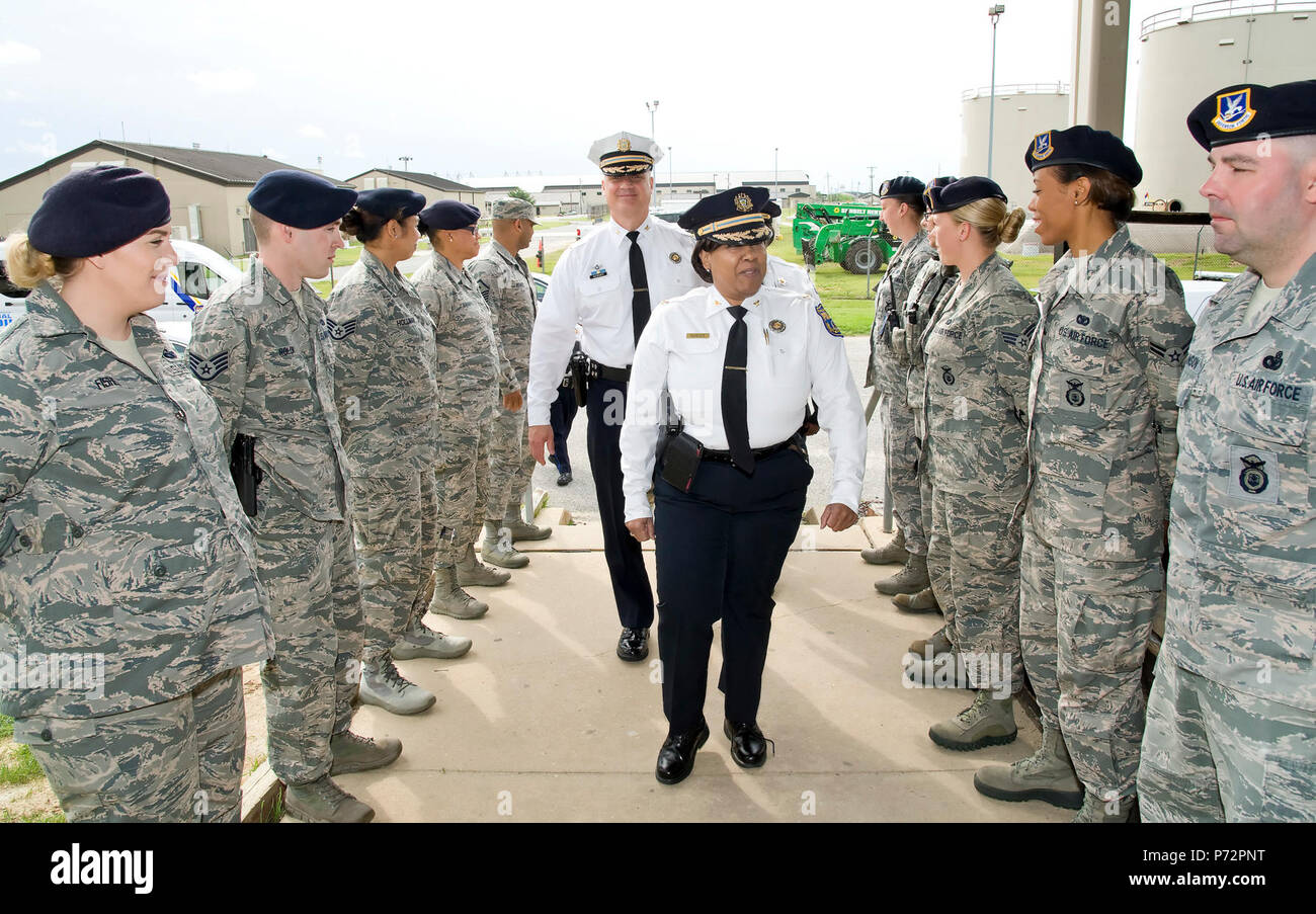 Members of the 436th Security Forces Squadron welcome Chief Inspector Cynthia Dorsey, Support Services, and Chief Inspector Christopher Werner, Training & Education Services, both from the Philadelphia Police Department, Philadelphia, Pa., to the squadron, May 11, 2017, at building 910 on Dover Air Force Base, Del. Fifteen members of the police department received a mission brief from the 436th SFS at the beginning of their visit. Stock Photo