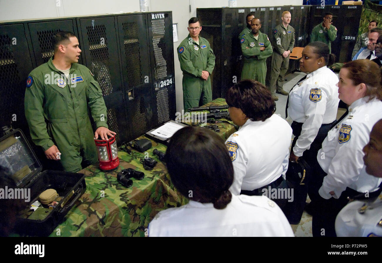 Staff Sgt. Steven Tayfel, a 436th Security Forces Squadron Raven, answers questions from members of the Philadelphia Police Department, Philadelphia, Pa., May 11, 2017, at Dover Air Force Base, Del. Tayfel and other Ravens talked about training requirements and equipment used by Ravens during off-station deployments. Stock Photo