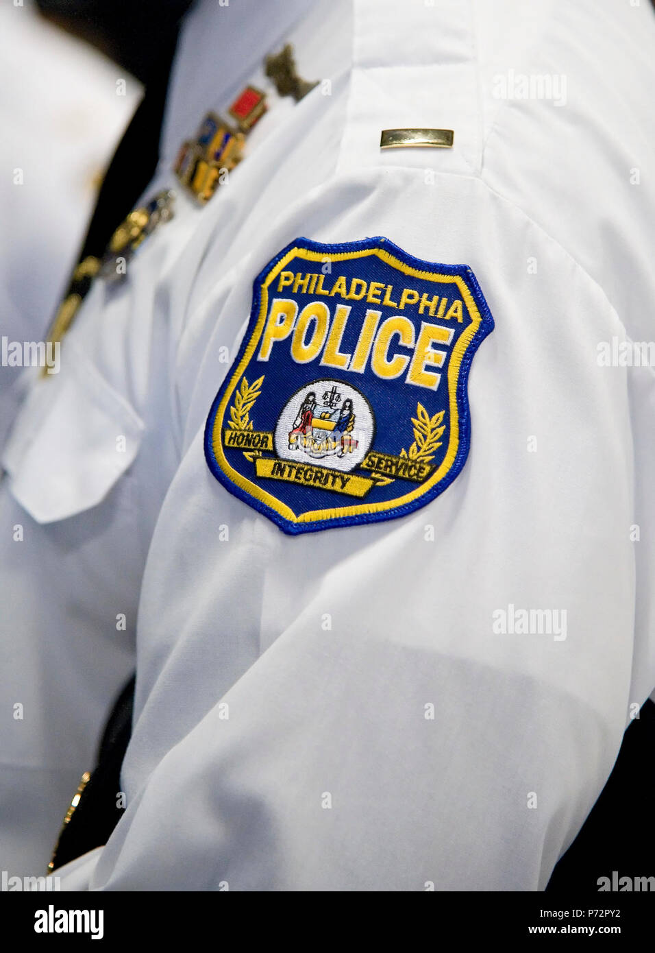 The Philadelphia Police Department, Philadelphia, Pa., patch is worn on the uniform of Lieutenant Austin Fraser, Philadelphia Police Department Firearms Training Unit, May 11, 2017, at Dover Air Force Base, Del. Fraser and 14 other members from the police department toured the Ravens section of the 436th Security Forces Squadron that included a Redman suit training demonstration, and a display of weapons used by Ravens. Stock Photo
