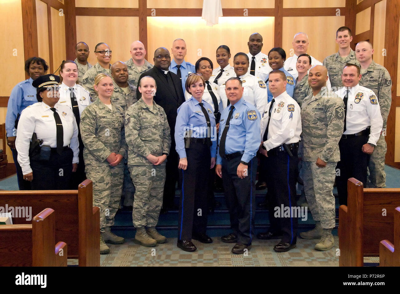 Members of the 436th Security Forces Squadron, Philadelphia Police Department, Philadelphia, Pa., and Base Chapel staff, pose for a group photo May 11, 2017, at Dover Air Force Base, Del. Fifteen members of the police department toured the 436th SFS, Air Force Mortuary Affairs Operations and Base Chapel during their five-hour visit to the base. Stock Photo