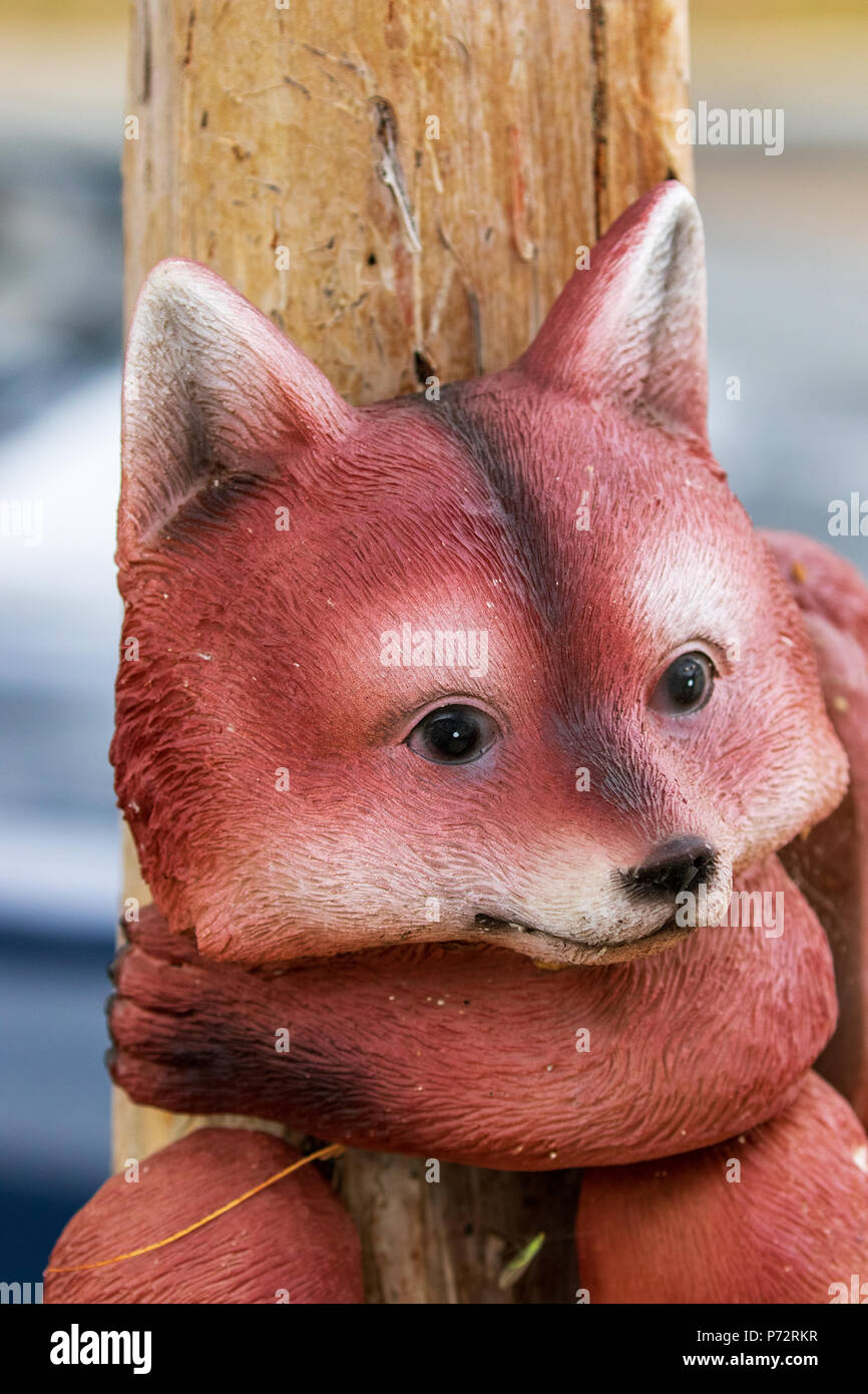 Whimsical Garden Art Decoration - Cute Red Fox Stock Photo