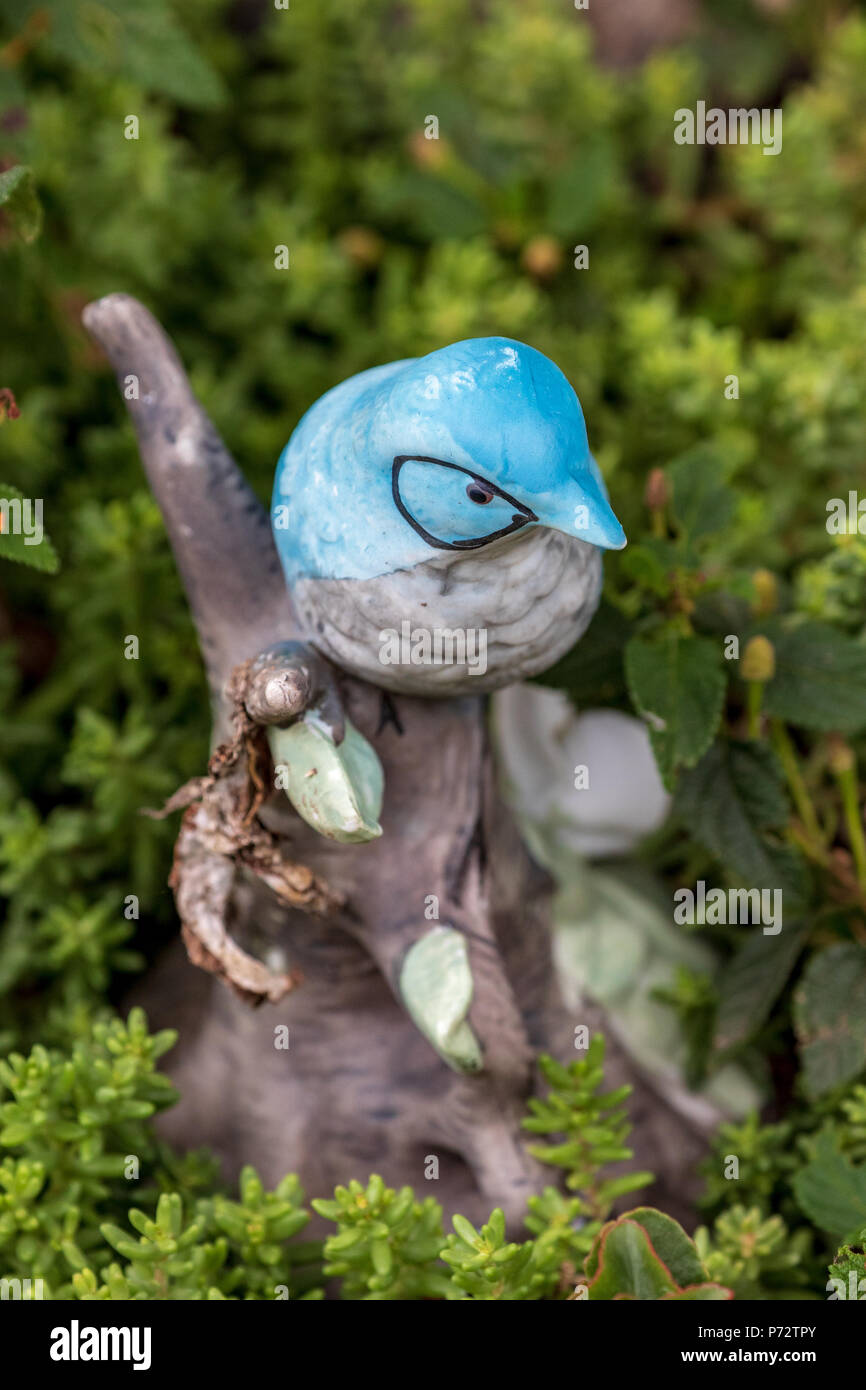 Whimsical Garden Art Decoration - Bluebird of Happiness Stock Photo