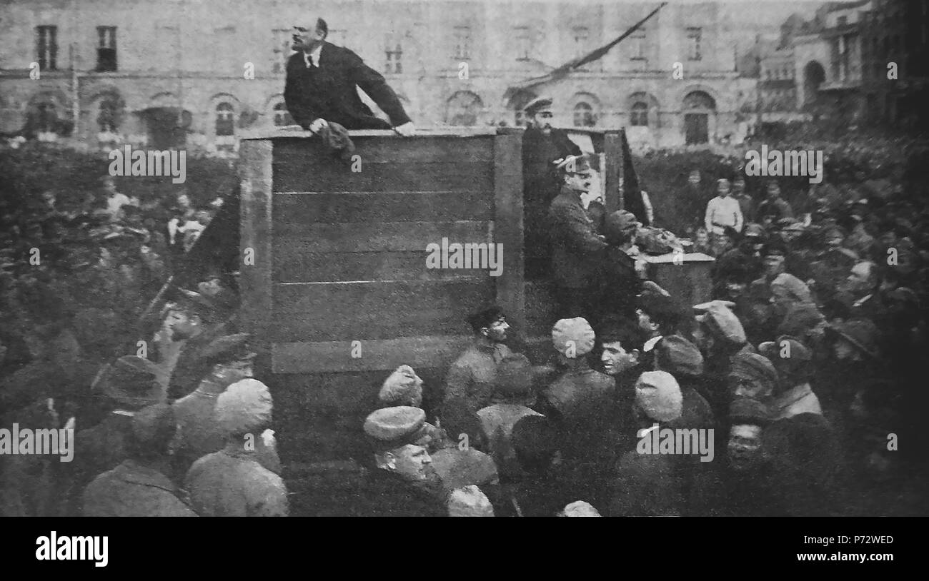 English: Vladimir Lenin, Chairman of the Council of People's Commissars (Prime Minister) of the Russian SFSR, delivers the speech to motivate the troops to fight on the Soviet-Polish war. Lev Kamenev, Deputy Chairman of the Council of People's Commissars (Deputy Prime Minister) and Leon Trotsky, People's Commissar of Military and Naval Affairs and the Head of Revolutionary Military Council, look from the steps. The speech was delivered during the Polish offensive and Lenin specifically said that the claims that Polish troops took over Kiev are untrue. Photo date: May 5 1920. The place is Theat Stock Photo