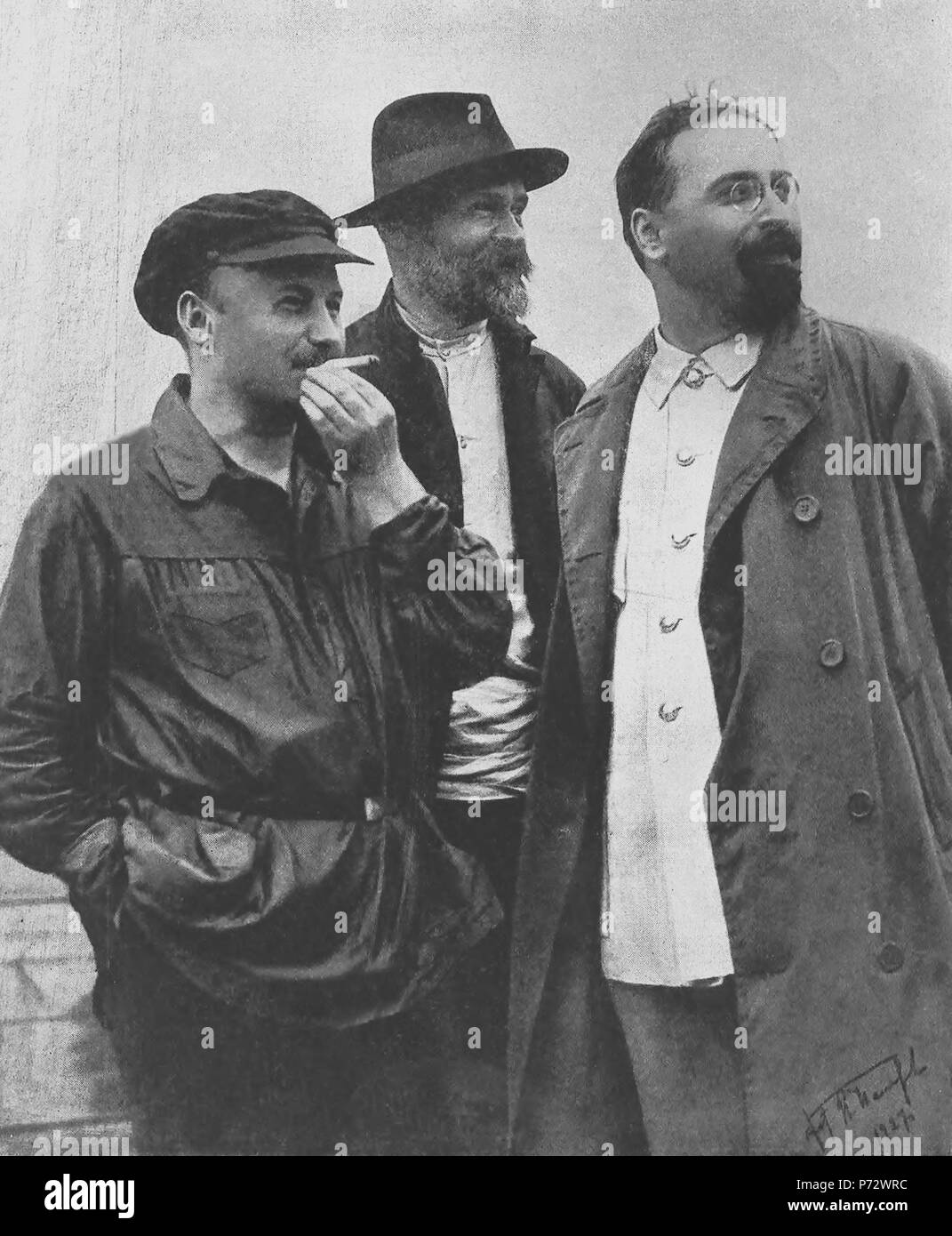 English: Old Bolsheviks: Nikolai Bukharin, the editor of Pravda and Projector. Ivan Skvortsov-Stepanov, the First People's Commissar (Minister) for Finance. Lev Karakhan, Deputy People's Commissar (Deputy Minister) for Foreign Affairs, the first Soviet Ambassador to China. Context: in one year after the photo’s publication, Joseph Stalin became de-facto dictator of the country. The lucky among three is Ivan Skvortsov-Stepanov since he had died from typhoid fever in Oct 1928 and buried in the Kremlin Wall Necropolis. Nikolai Bukharin confessed as “the enemy of the people” during Trial of Twenty Stock Photo
