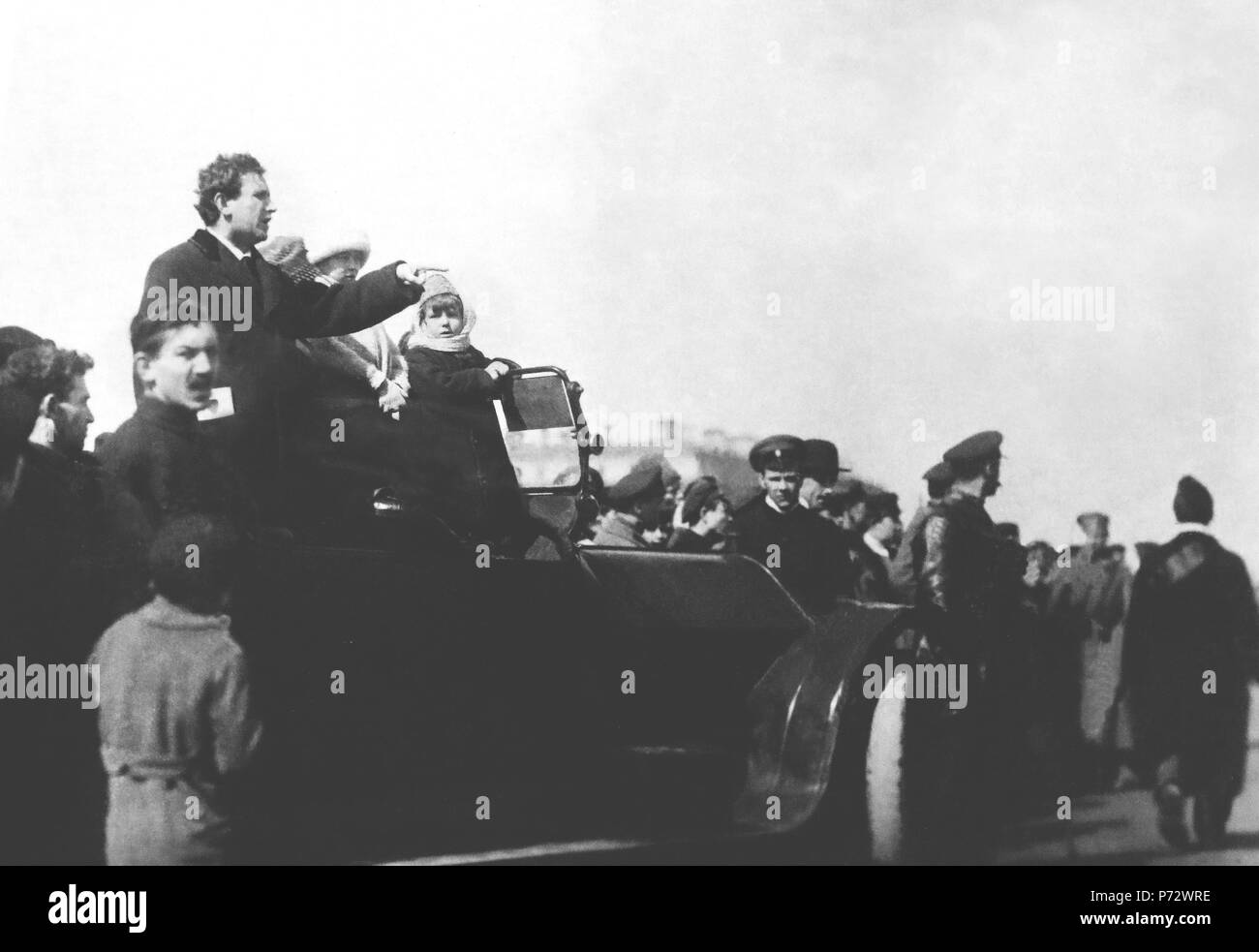 English: Grigory Zinoviev, Chairman of The Petrograd Soviet addresses the crowd on the first International Workers' Day after the October Uprising (the Bolshevik Revolution). Date: May 1 1918. Place: Fields of Mars, Petrograd. Context: Zinoviev was one of the seven leaders of the first Politburo, founded in 1917 in order to manage the Uprising in 1917: Lenin, Trotsky, Zinoviev, Kamenev, Stalin, Sokolnikov, and Bubnov. He became the Chairman of the Executive Committee of the Comintern when it was created in March 1919 to spread the uprising worldwide. Grigory Zinoviev was executed in 1936, foll Stock Photo