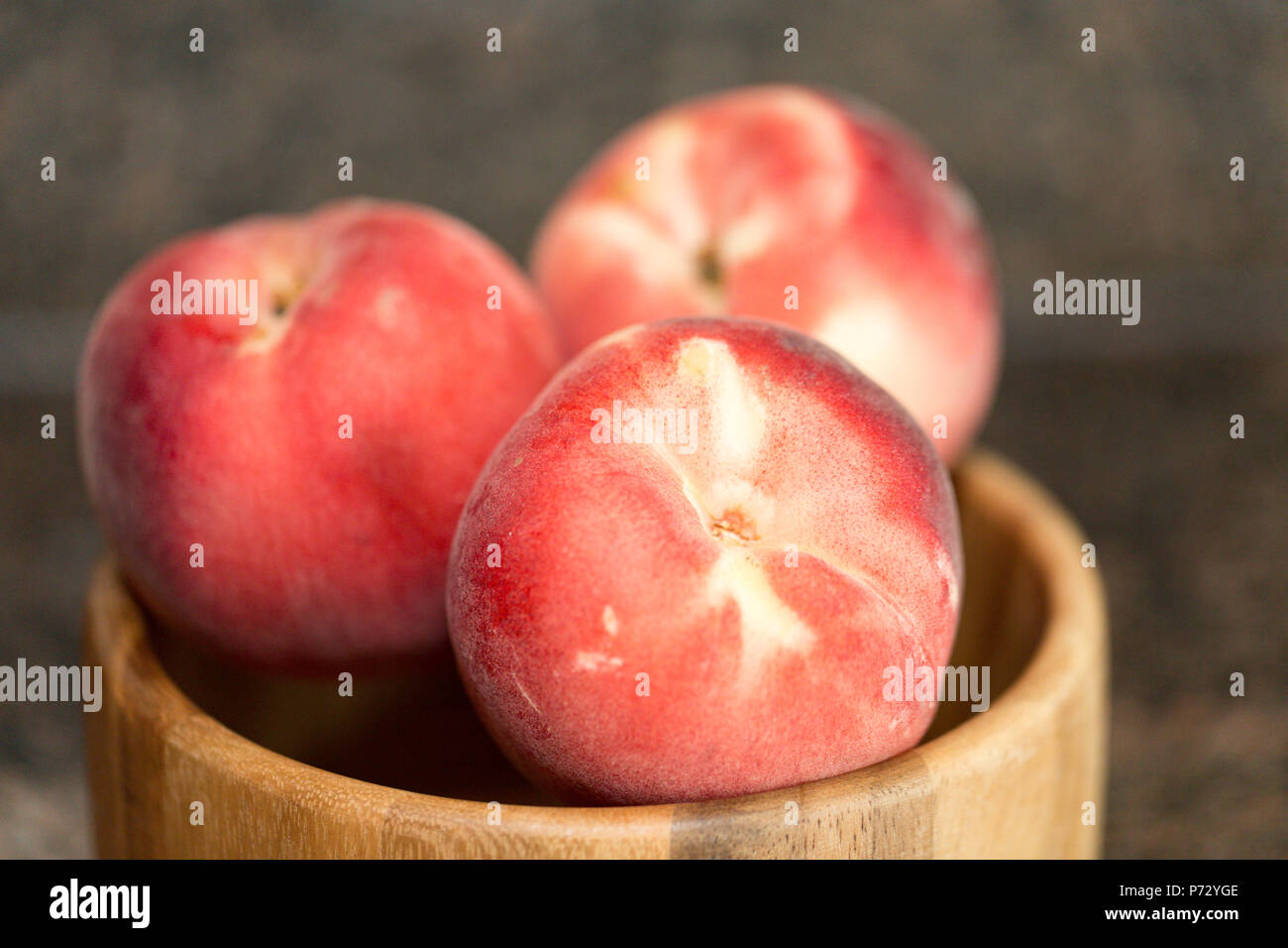Peach isolated on table. Full depth of field. Stock Photo