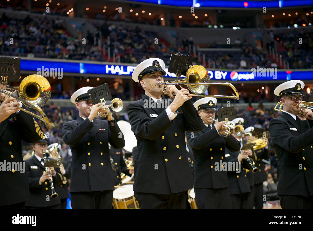 WASHINGTON (March 28, 2014) The U.S. Navy Ceremonial Band performs at halftime during a basketball game between the Washington Wizards and the Indiana Pacers at the Verizon Center in Washington. The Navy Band performance was part of the team’s Military Appreciation Night. Stock Photo