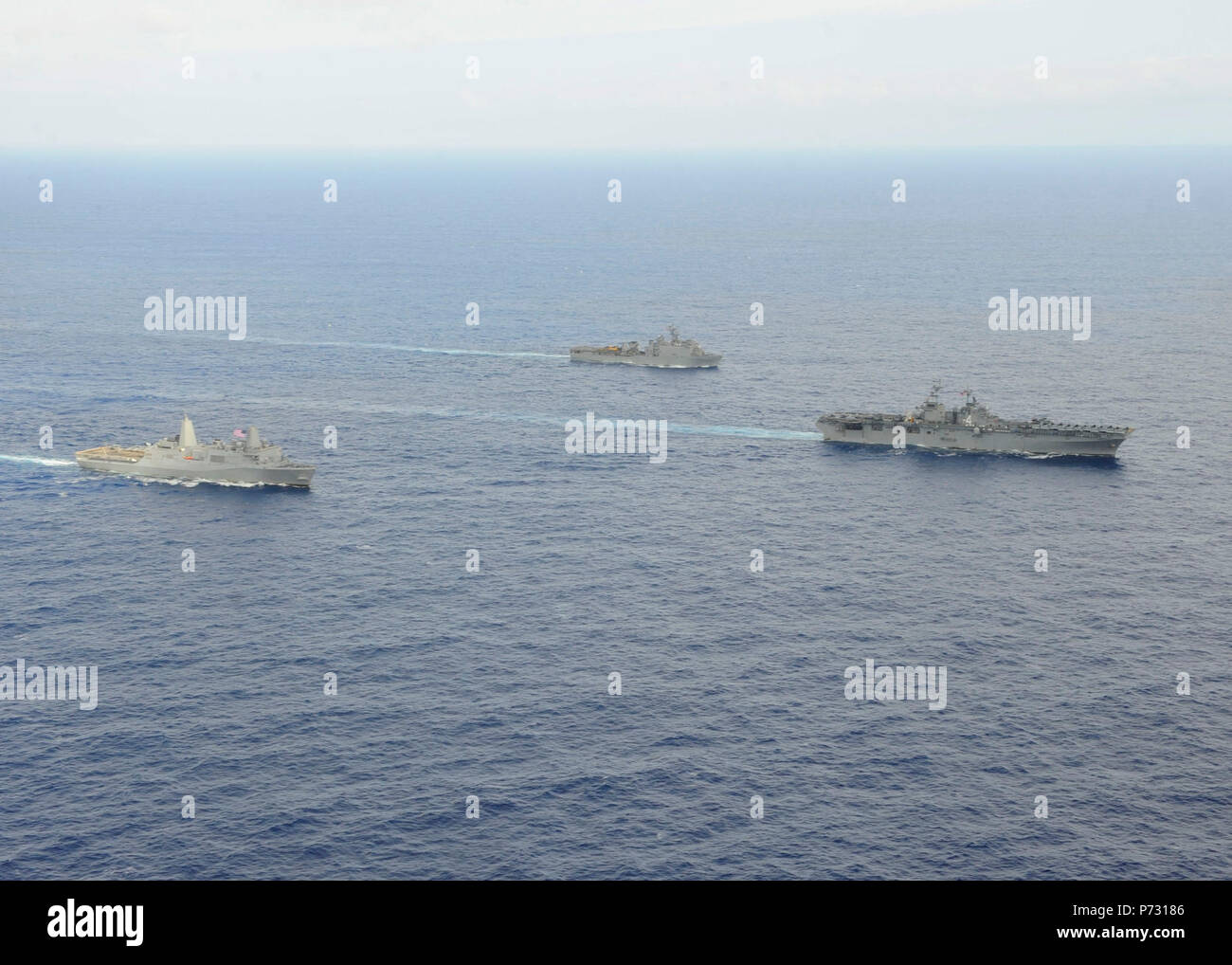 OCEAN (April 18, 2014) The amphibious assault ship USS Boxer (LHD 4), the amphibious dock landing ship USS Harpers Ferry (LSD 49), and the amphibious transport dock ship USS New Orleans (LPD 18) are underway, with the embarked 13th Marine Expeditionary Unit (13th MEU), as part of the Boxer Amphibious Ready Group. The ships are returning to homeport at San Diego from an eight-month deployment to the western Pacific and the U.S. Central Command areas of responsibility. Stock Photo