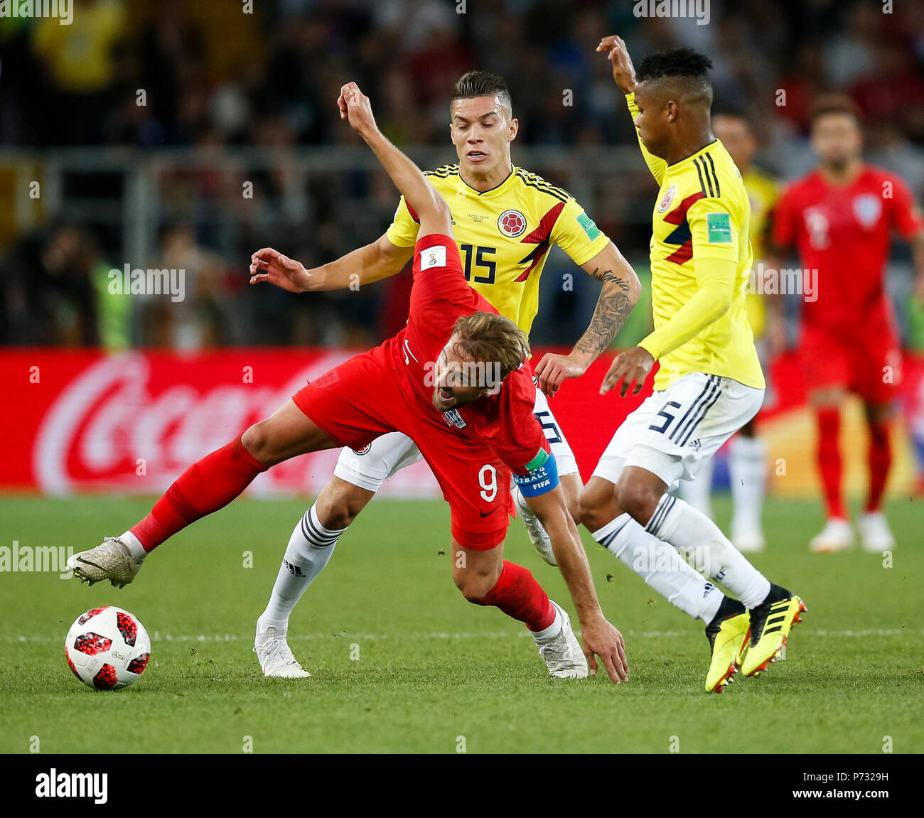 Moscow, Russia. 3rd July, 2018. Harry Kane of England is fouled by Mateus Uribe of Colombia and Wilmar Barrios of Colombia during the 2018 FIFA World Cup Round of 16 match between Colombia and England at Spartak Stadium on July 3rd 2018 in Moscow, Russia.Credit: PHC Images/Alamy Live News Stock Photo