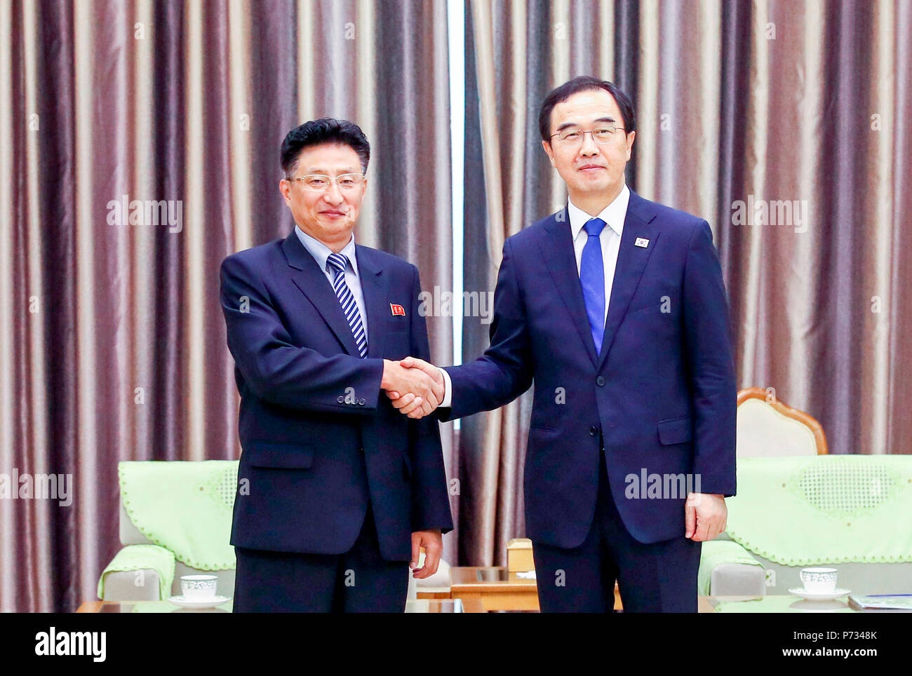 Cho Myoung-Gyon and Won Kil-U, July 3, 2018 : North Korea's Vice Sports Minister Won Kil-U (L) and South Korean Unification Minister Cho Myoung-Gyon pose upon the latter's arrival at the Pyongyang Sunan International Airport in Pyongyang, North Korea. The 100-strong South Korean delegation of athletes, coaches, government officials and journalists arrived in Pyongyang on Tuesday. South and North Korea plan to hold four inter-Korean friendly basketball matches in Pyongyang on Wednesday and Thursday. The inter-Korean basketball matches will be held for the first time in 15 years. EDITORIAL USE O Stock Photo