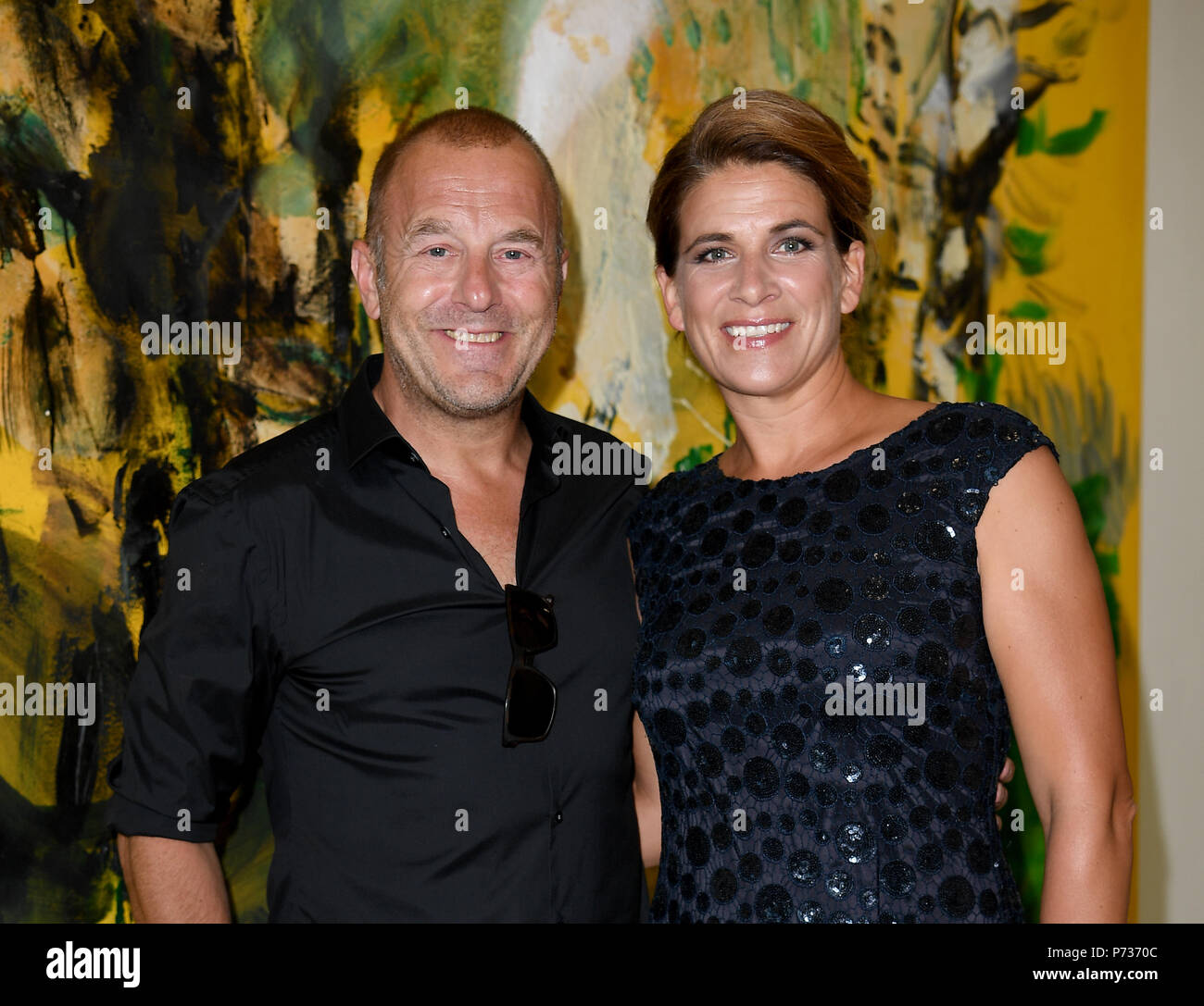Berlin, Germany. 03rd July, 2018. Actor Heino Ferch and his wife Marie-Jeanette attend an installation of the fashion label Laurel at the Berlin Fashion Week, which runs until 07 July and showcases collections for the spring and summer of 2019. Credit: Britta Pedersen/dpa-Zentralbild/dpa/Alamy Live News Stock Photo