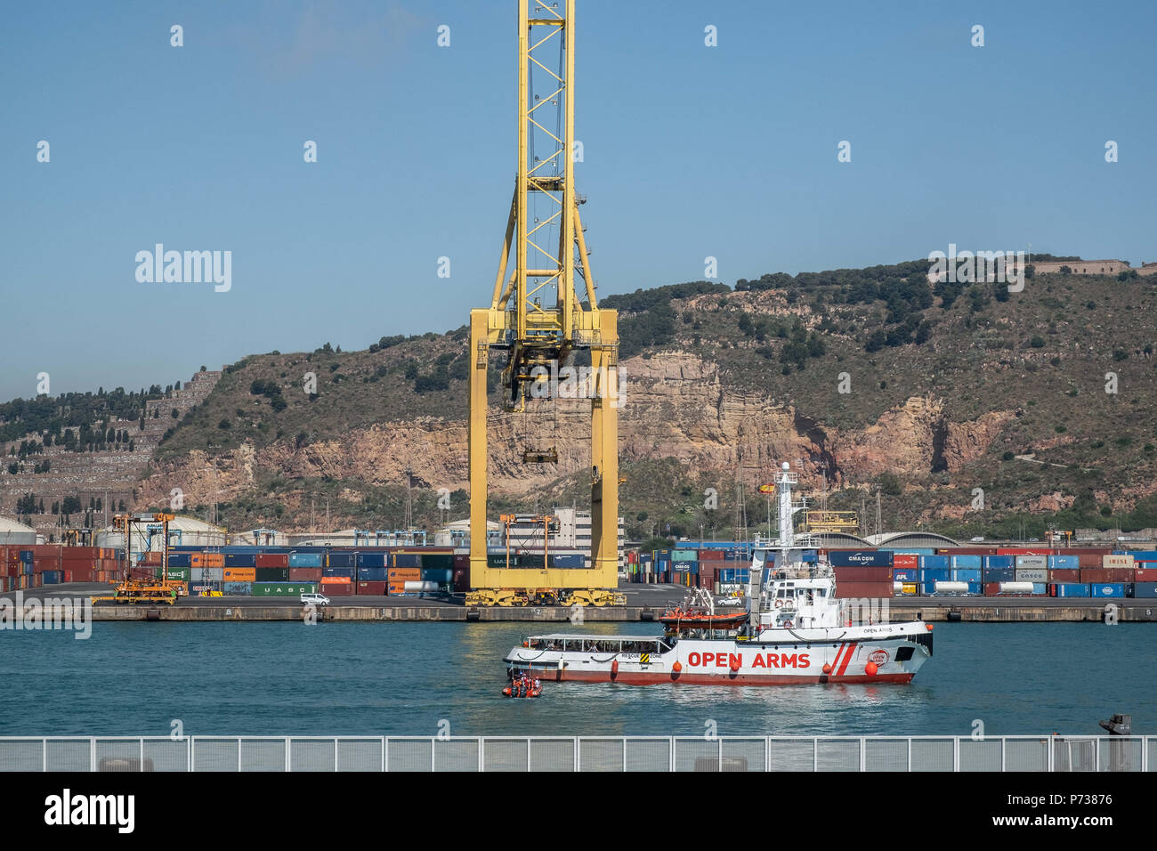 Barcelona, Catalonia, Spain. 4th July, 2018. The rescue boat Proactiva Open Arms has docked in Barcelona with 60 people rescued in the Mediterranean off the coast of Libya. Barcelona has offered itself as a refuge city after Italy's refusal to continue hosting more rescues carried out by NGOs. Credit: Paco Freire/SOPA Images/ZUMA Wire/Alamy Live News Stock Photo