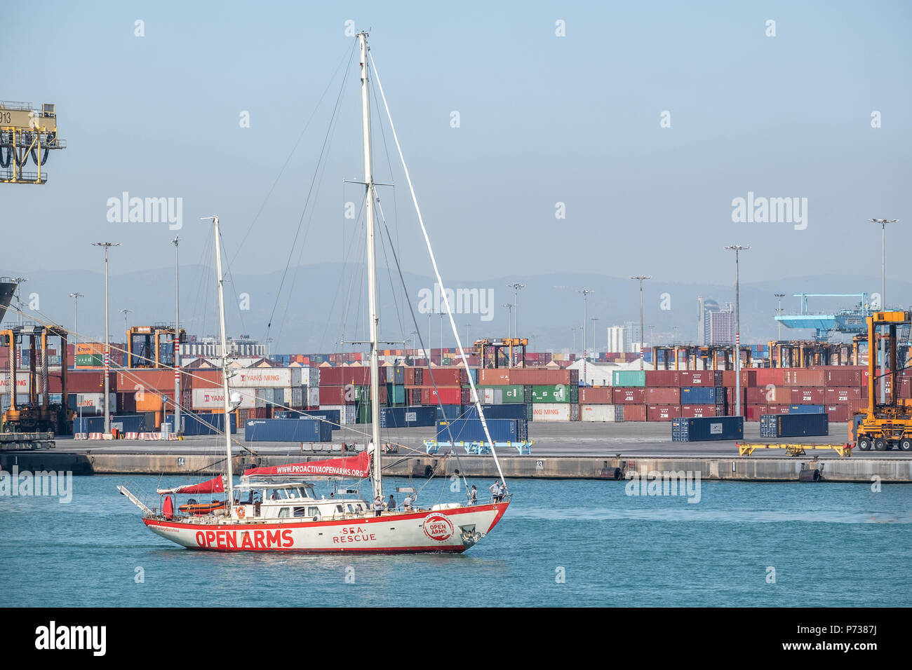 Barcelona, Catalonia, Spain. 4th July, 2018. The rescue sailing boat Proactiva Open Arms has docked in Barcelona with 60 people rescued in the Mediterranean off the coast of Libya. Barcelona has offered itself as a refuge city after Italy's refusal to continue hosting more rescues carried out by NGOs. Credit: Paco Freire/SOPA Images/ZUMA Wire/Alamy Live News Stock Photo