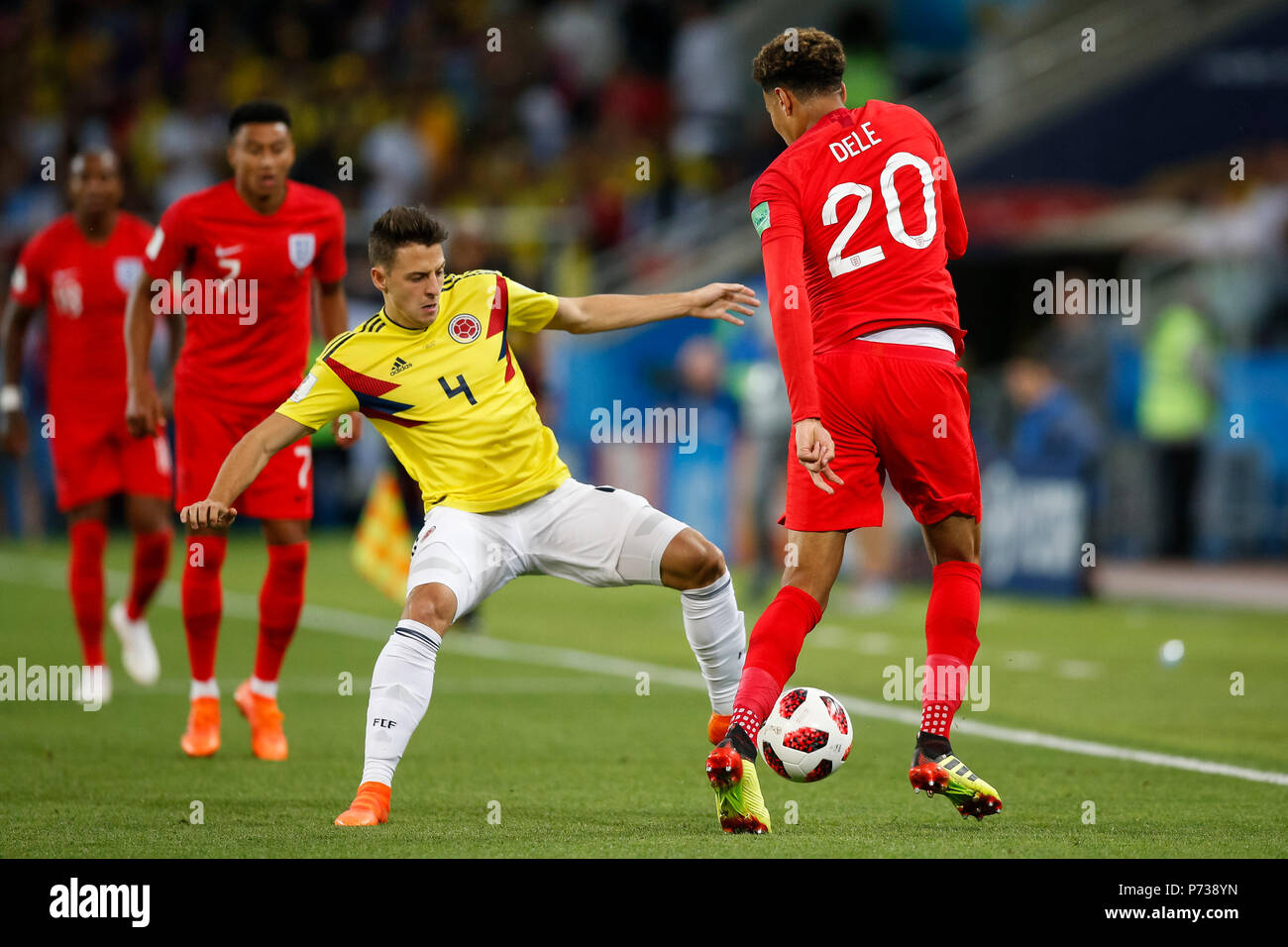Moscow, Russia. 3th July 2018. Dele Alli of England is tackled by Santiago Arias of Colombia during the 2018 FIFA World Cup Round of 16 match between Colombia and England at Spartak Stadium on July 3rd 2018 in Moscow, Russia. Credit: PHC Images/Alamy Live News Stock Photo
