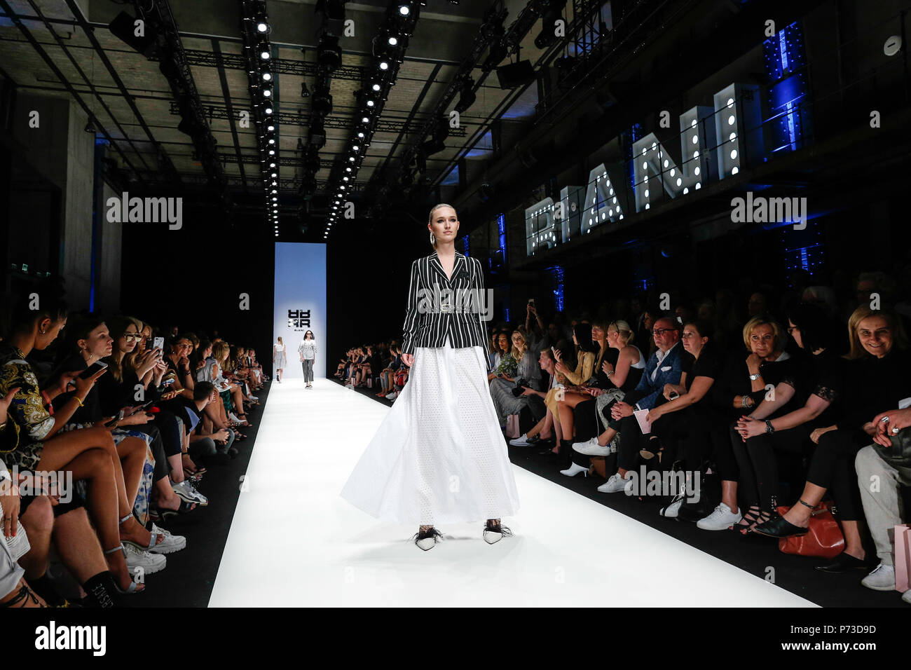 Berlin, Germany - July 4, 2018: Models presents a Spring/Summer 2019 Riani collection during the second day of MBFW Berlin Fashion Weak in the ewerk showspace in Berlin Stock Photo