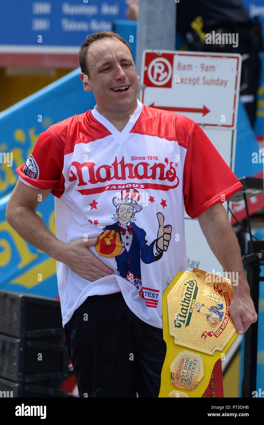 New York, US. 4th July 2018. Joey Chestnut celebrates after winning the annual Nathan's Hot Dog Eating Contest on July 4, 2018 Brooklyn, New York. Chestnut set a Coney Island record, eating 74 hot dogs in 10 minutes. Credit: Erik Pendzich/Alamy Live News Stock Photo