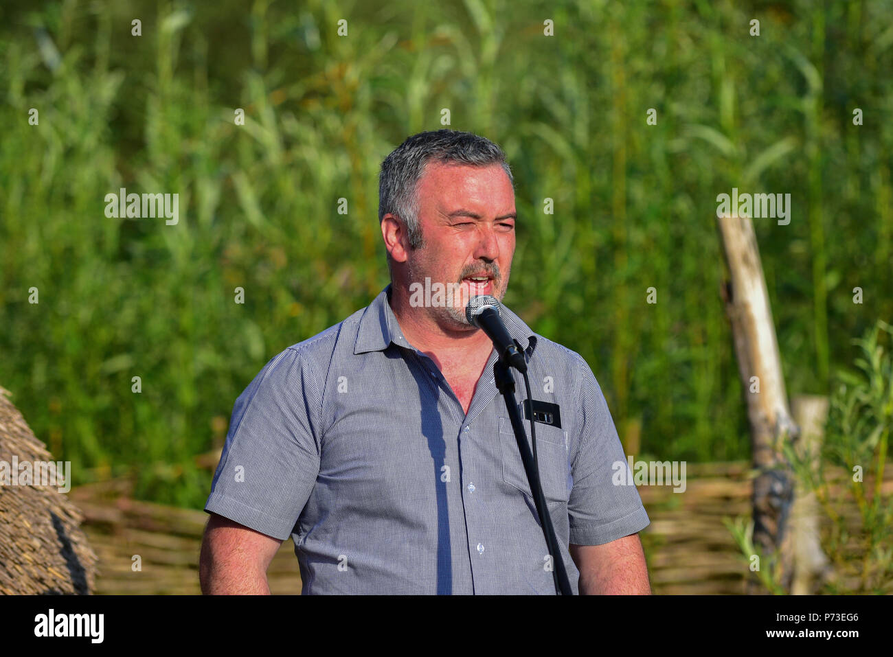 County Tyrone, UK. 4th July, 2018. Local Save our Sperrins Activist Sean Tracey speaks to gathered members of  Activists groups and community members fighting against the proposed destruction of the Sperrin Mountains in County Tyrone.  County Tyrone: UK:4th July 2018 Credit: Mark Winter/Alamy Live News Stock Photo