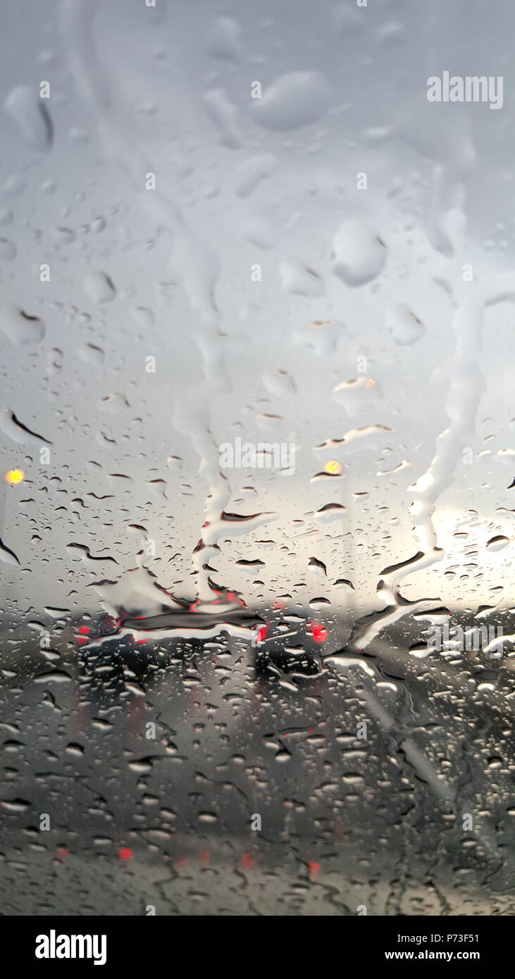 Inside the car. Closeup rain water drops. car windshield view ...