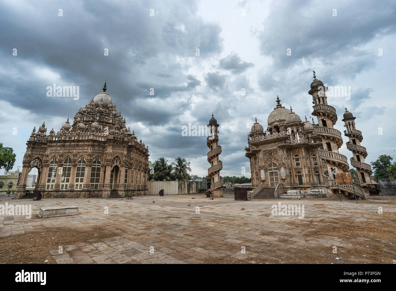 Wide angle images of Mahabat Maqbara a tomb of Mughal times, a neglected heritage architecture monument at Junagadh, Gujarat, India - dramatic clouds Stock Photo