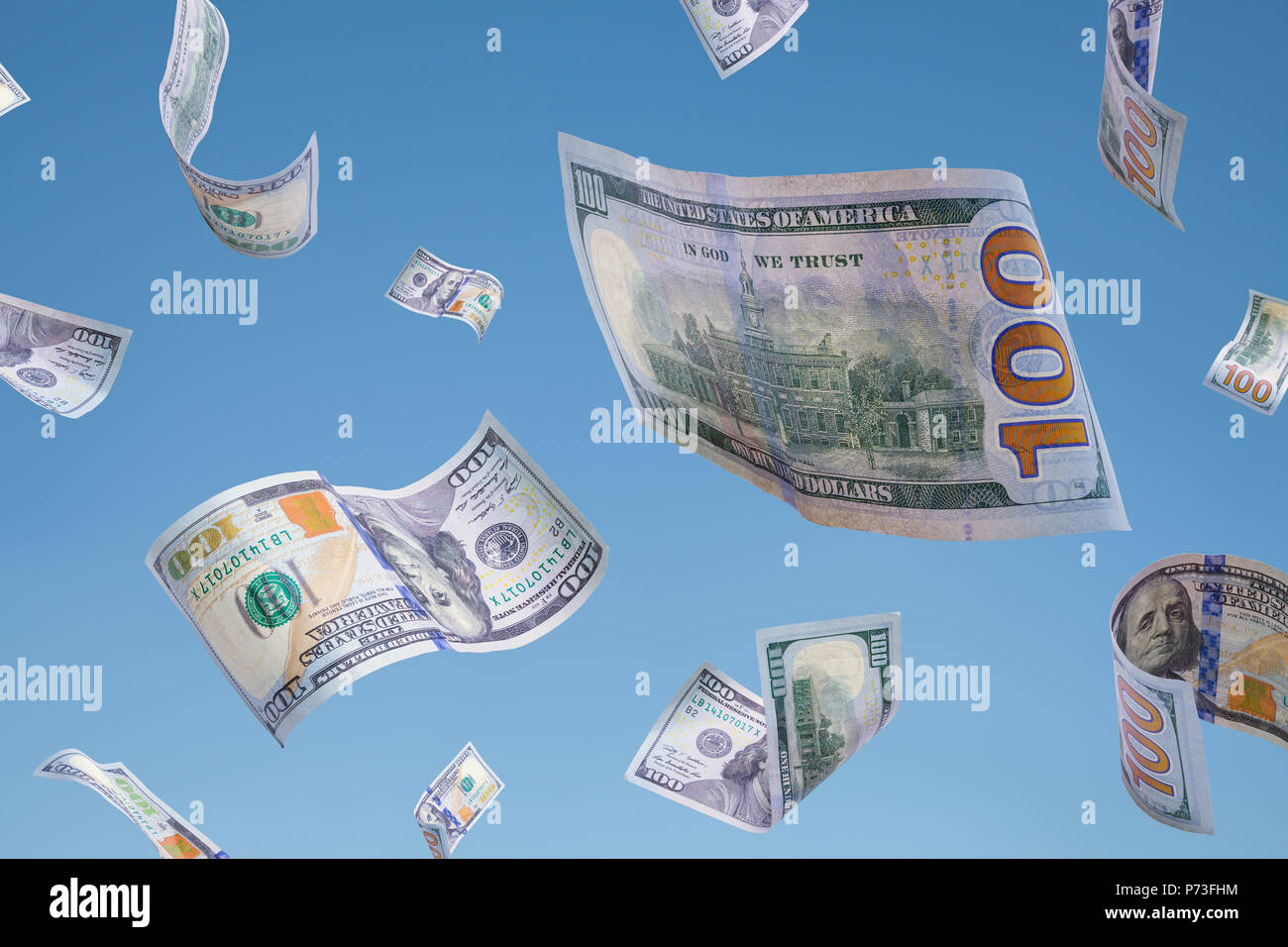 Money Falling Down in a Blue Sky. Stock Photo