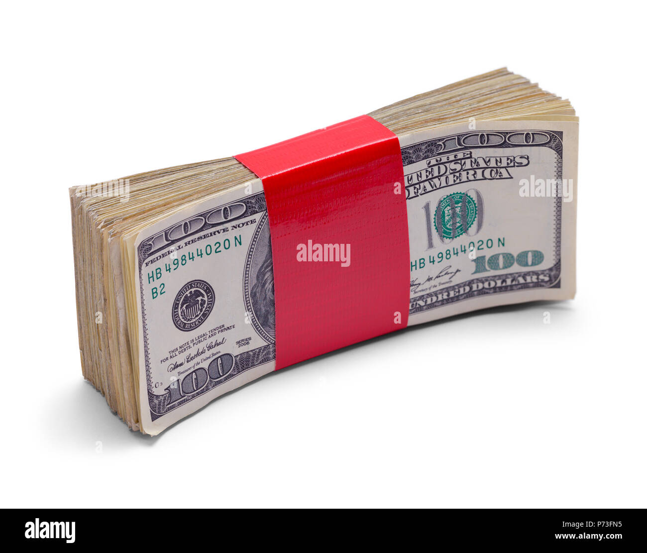 Stack of Money with Red Tape Isolated on White Background. Stock Photo