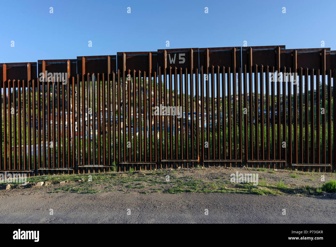 United States Border Fence, pedestrian barrier, west of Nogales Arizona, viewed from US side, Nogales Sonora Mexico visible beyond fence, April, 2018 Stock Photo