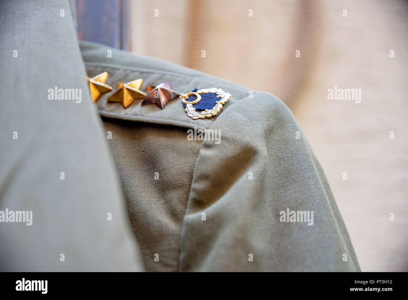 View of green Turkish military uniform with epaulettes on shoulder strap is sold in a shop in Istanbul,Turkey.11 December 2016 Stock Photo