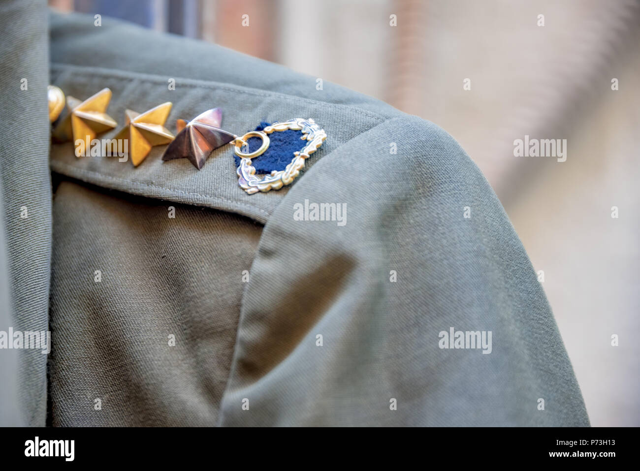 View of green Turkish military uniform with epaulettes on shoulder strap is sold in a shop in Istanbul,Turkey.11 December 2016 Stock Photo