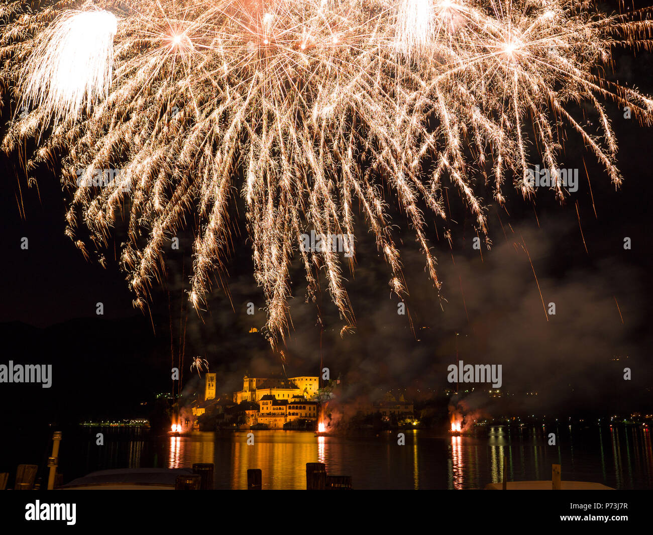 amazing colorful fireworks display on San Giulio island. Piedmont,Italy Stock Photo