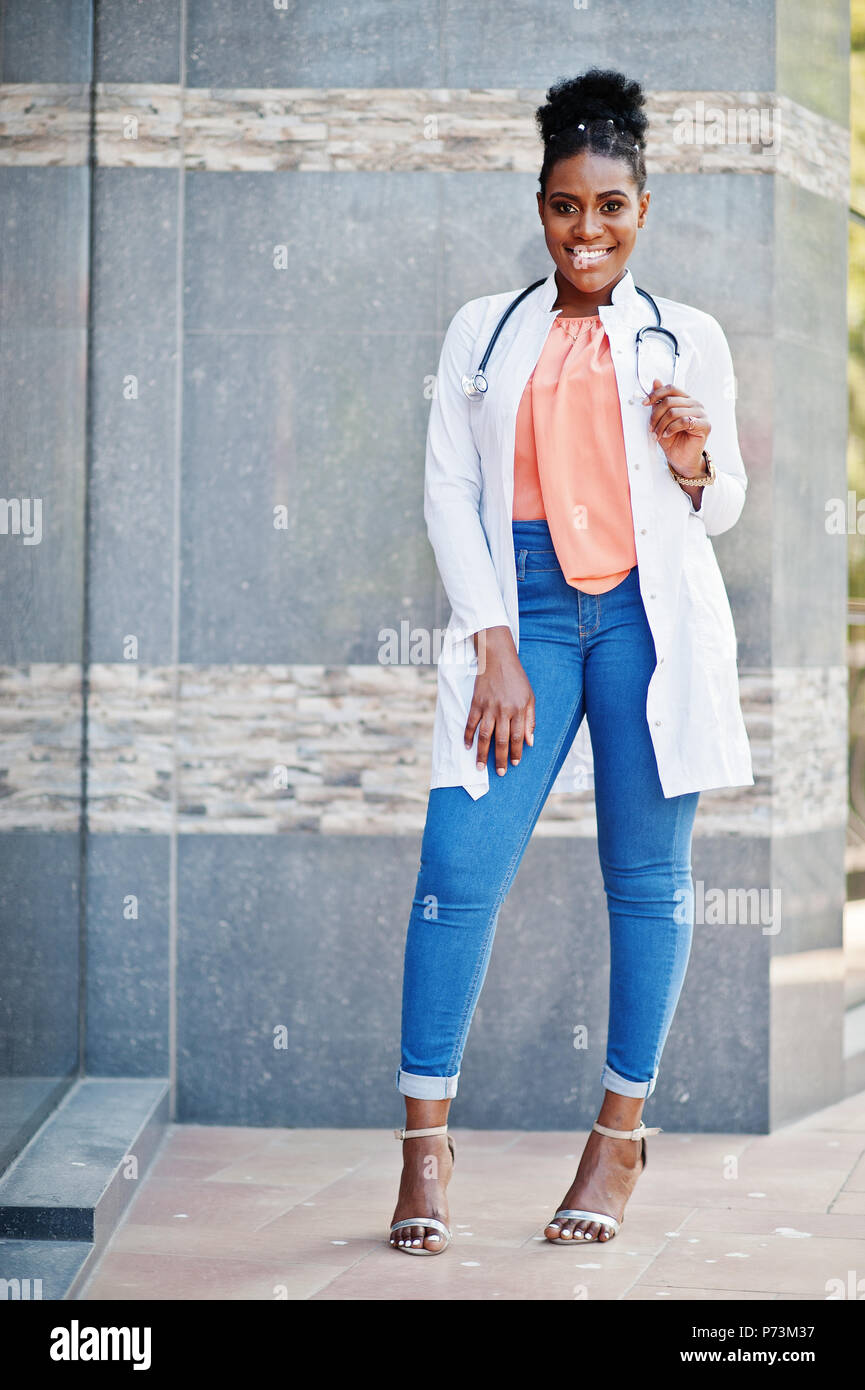 African american doctor female at lab coat with stethoscope posed outdoor  against clinic Stock Photo - Alamy