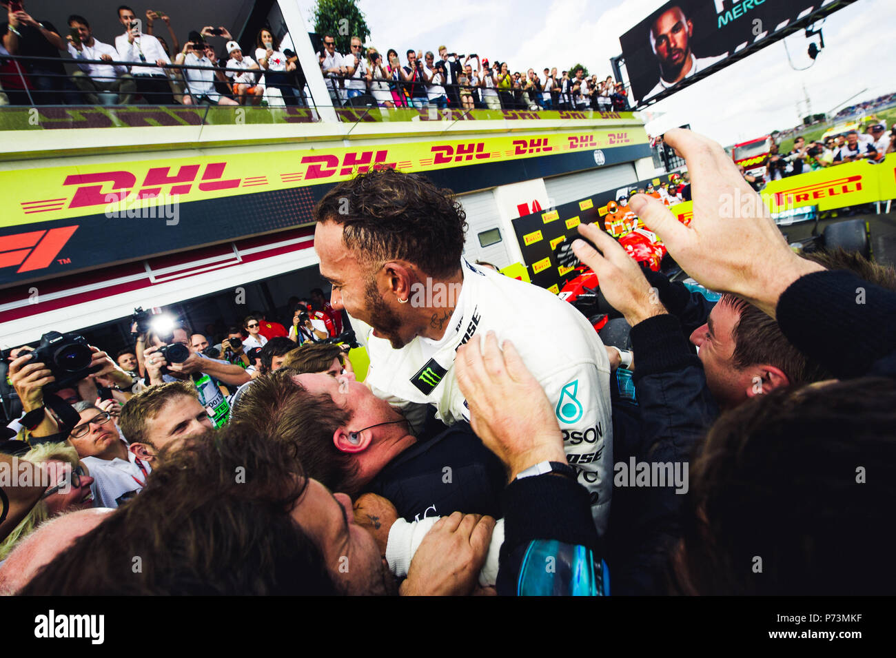Lewis Hamilton celebrates victory at the 2018 French Grand Prix with his Mercedes team mates. Credit: Sergey Savrasov / Spacesuit Media. Stock Photo