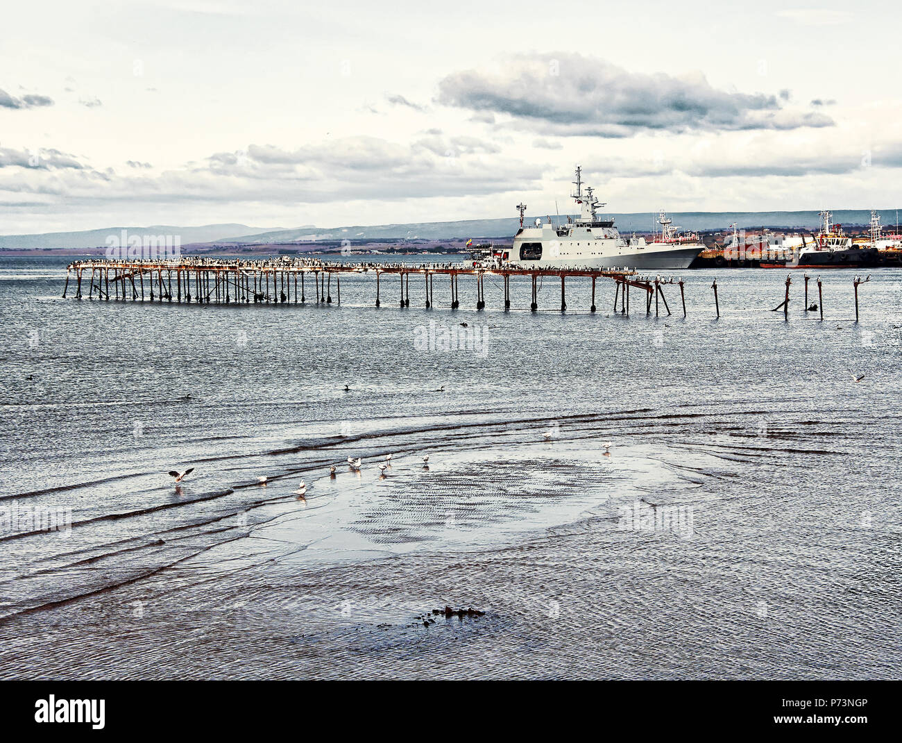 Scenic view  of the harbour and the seaport in Punta Arenas, Chile with standing at the pier large ship Stock Photo