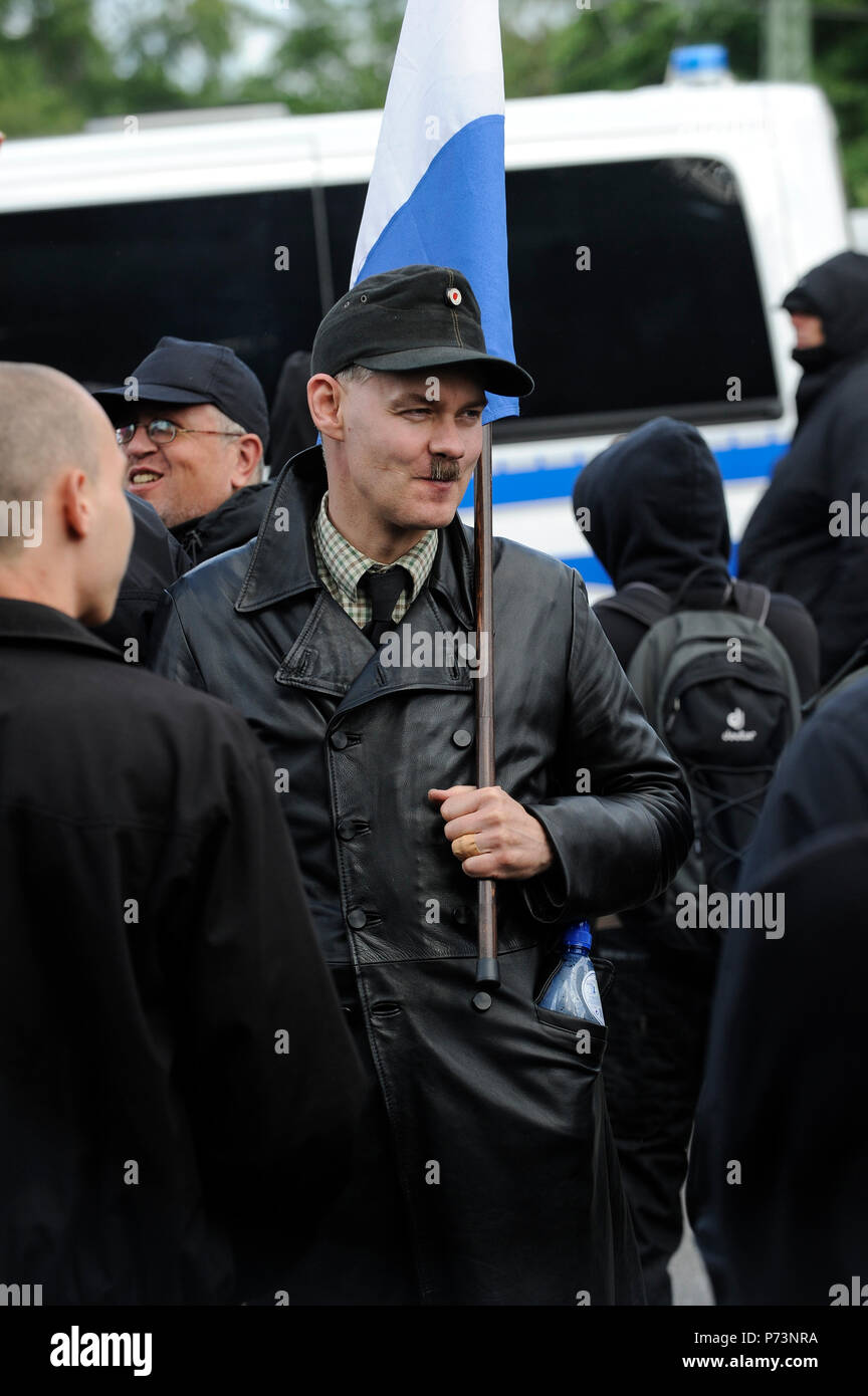 Germany, rally of Nazi and right extremists groups in hamburg, Neo Nazi activist with Adolf Hitler moustache Stock Photo