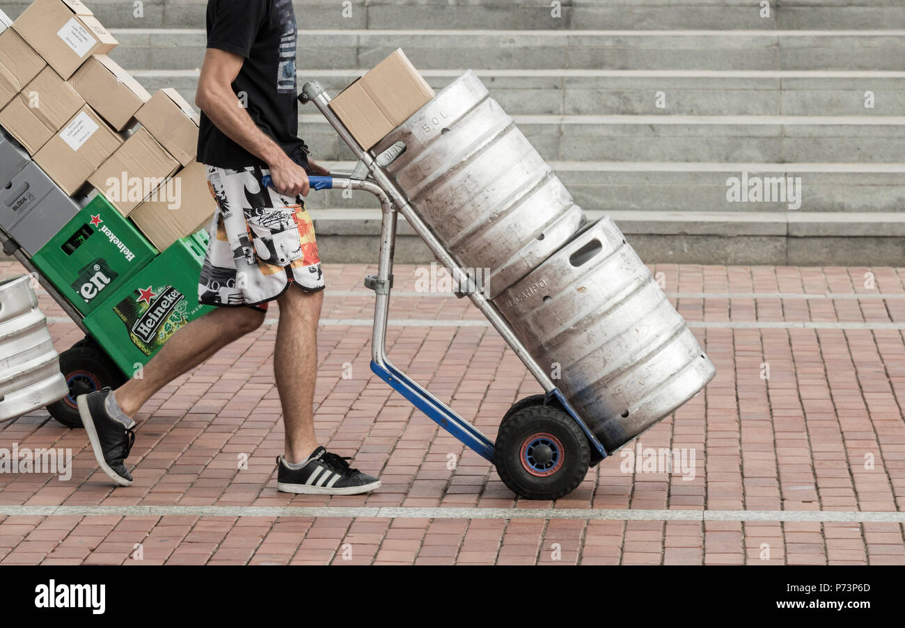 HGV driver delivering beer barrels, kegs to bars. HGV driver shortage