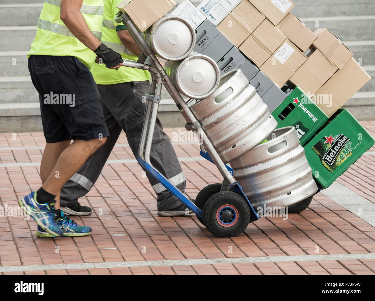 HGV driver delivering beer barrels, kegs to bars. HGV driver shortage